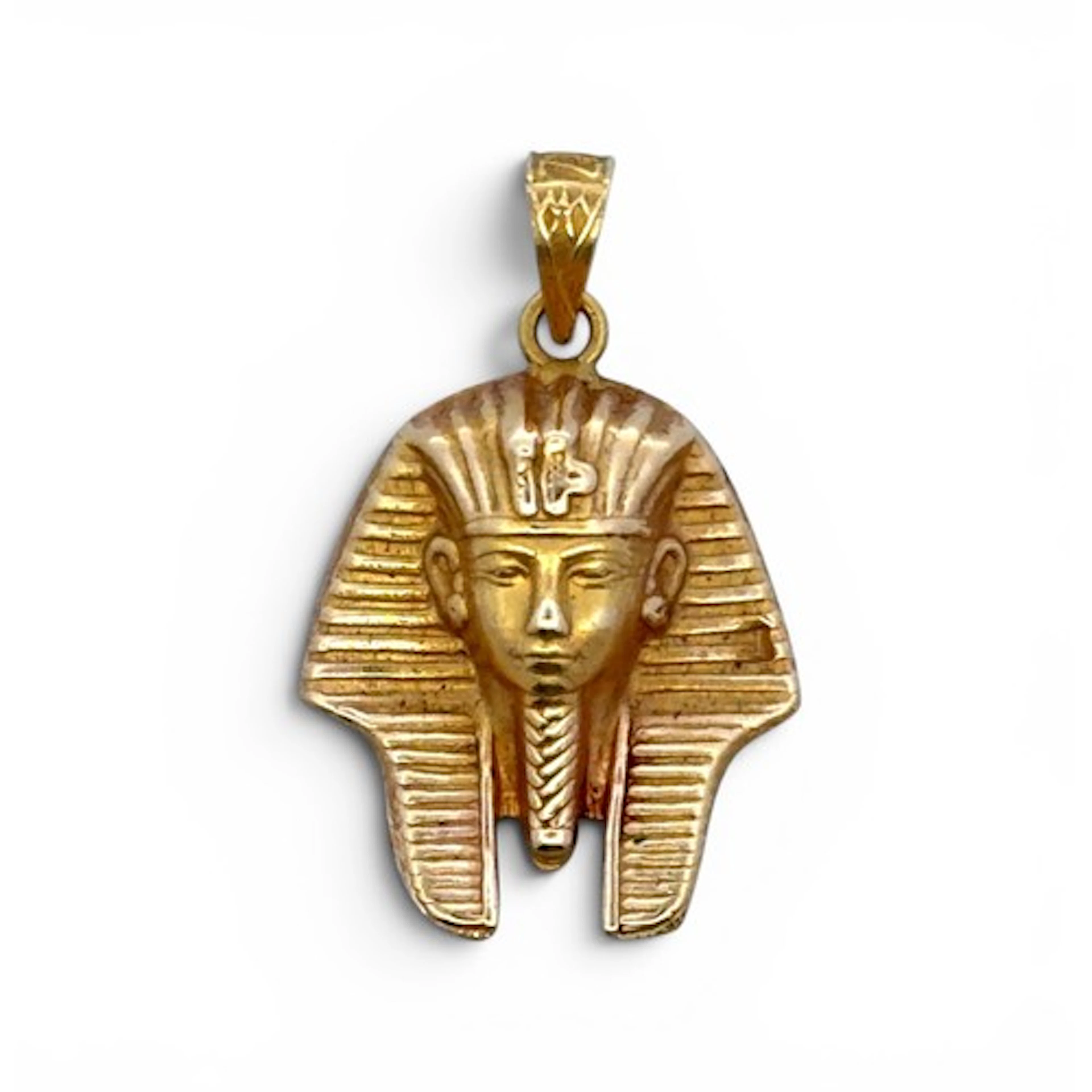 A Tutunkhamun mask charm, unmarked, tested as approx 18ct go...