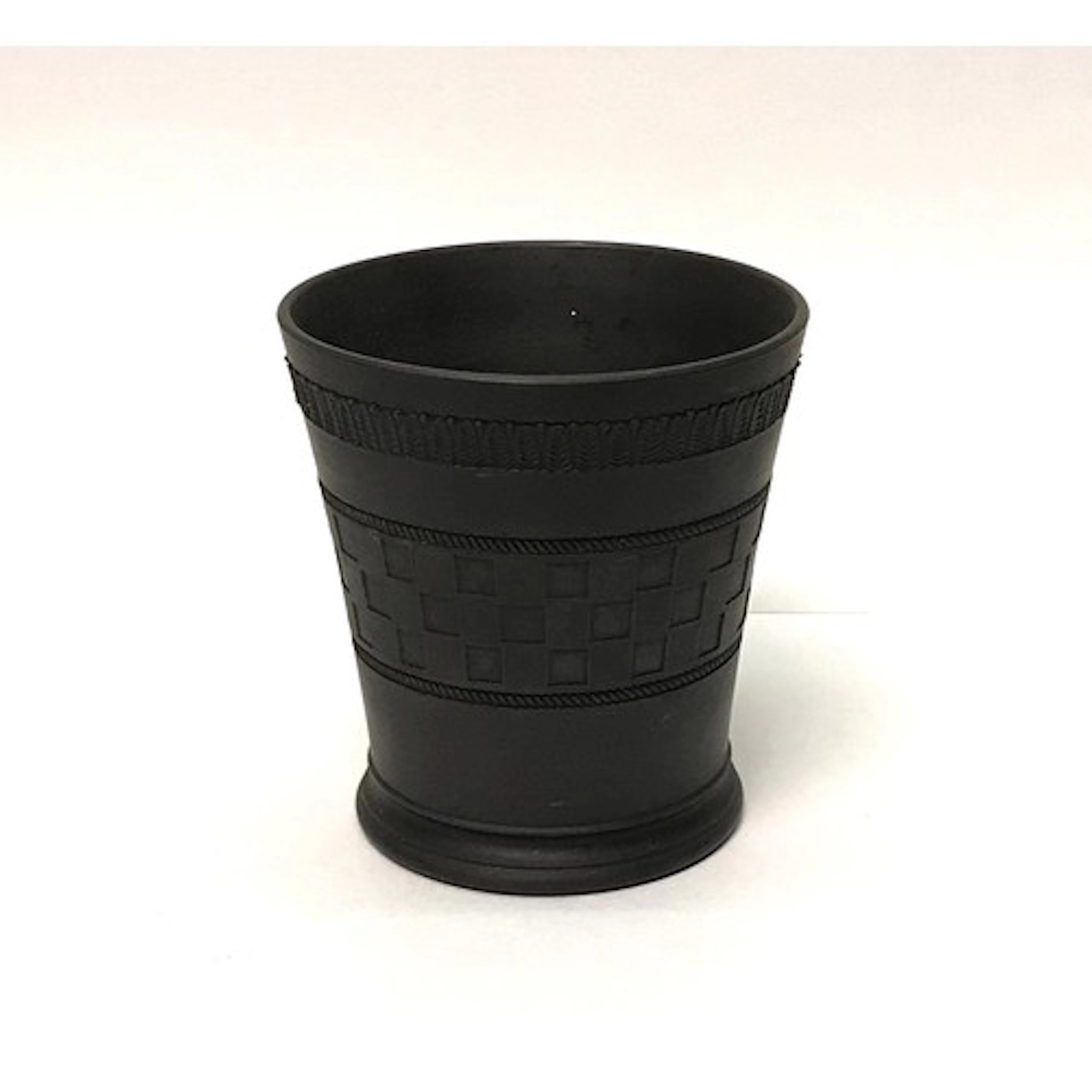 A Wedgewood black basalt beaker flared formed in relief with...