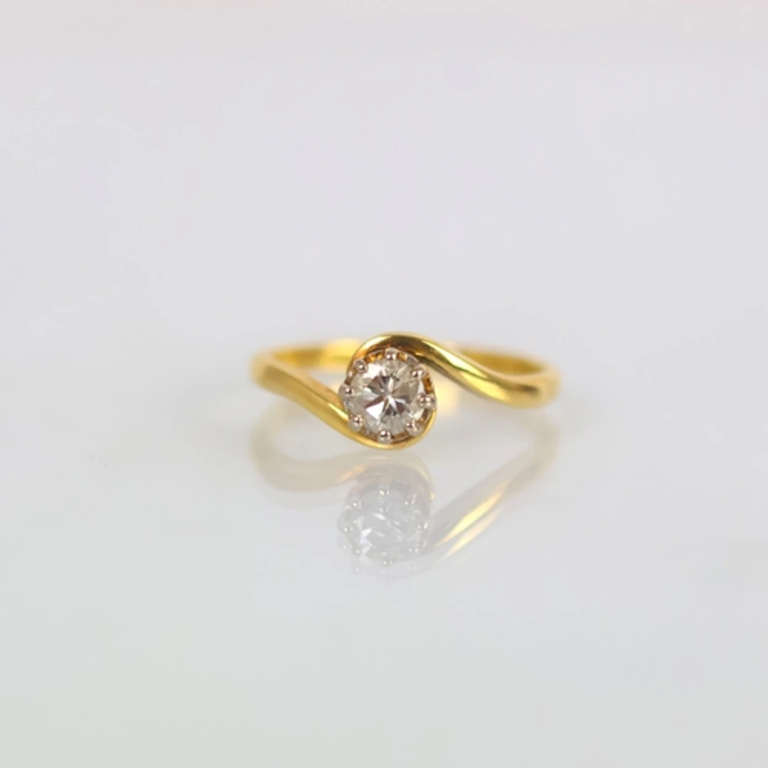 A mid 20th century diamond solitaire ring, the central round...