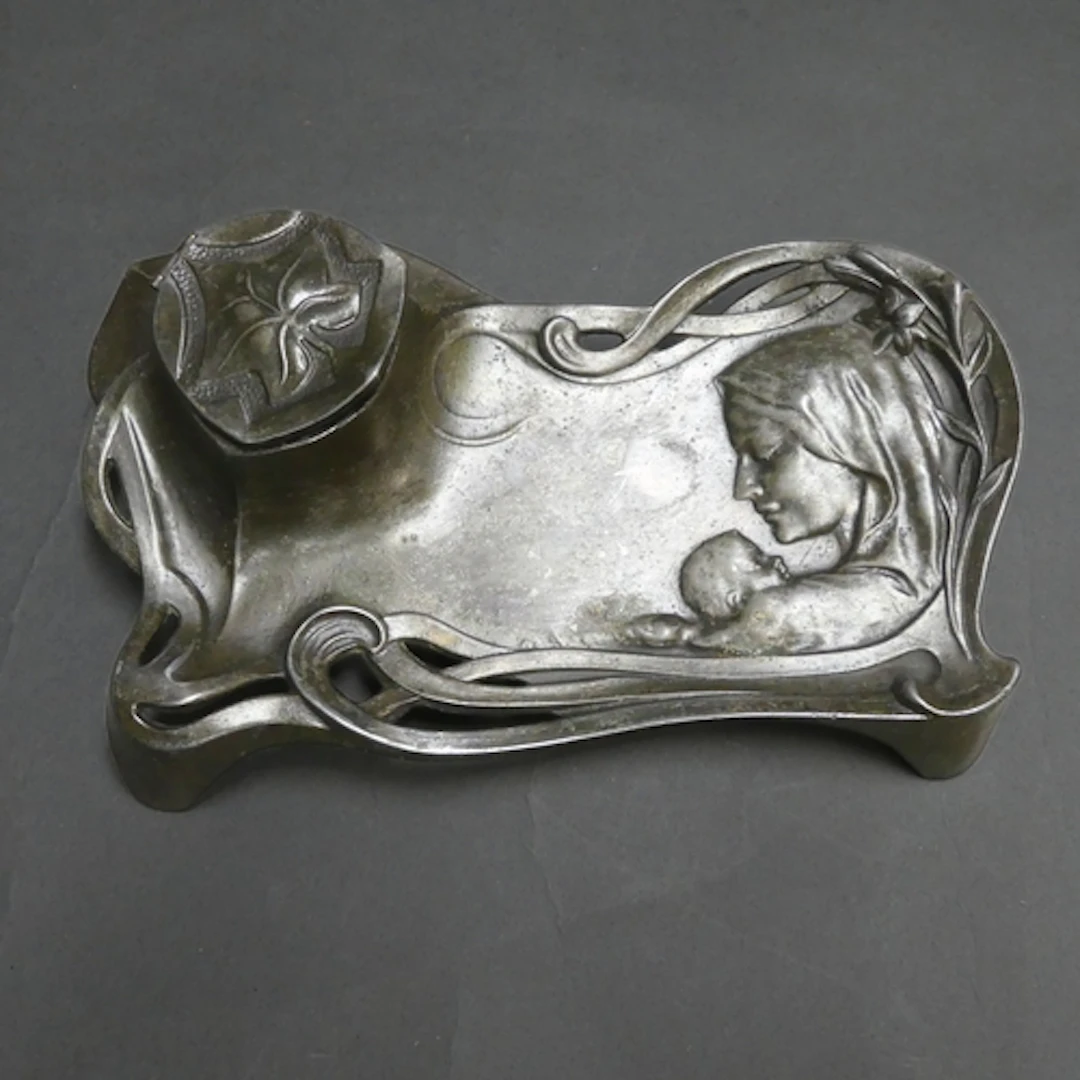 An Art Nouveau bronzed pewter desk stand, Alphonse Mucha des...