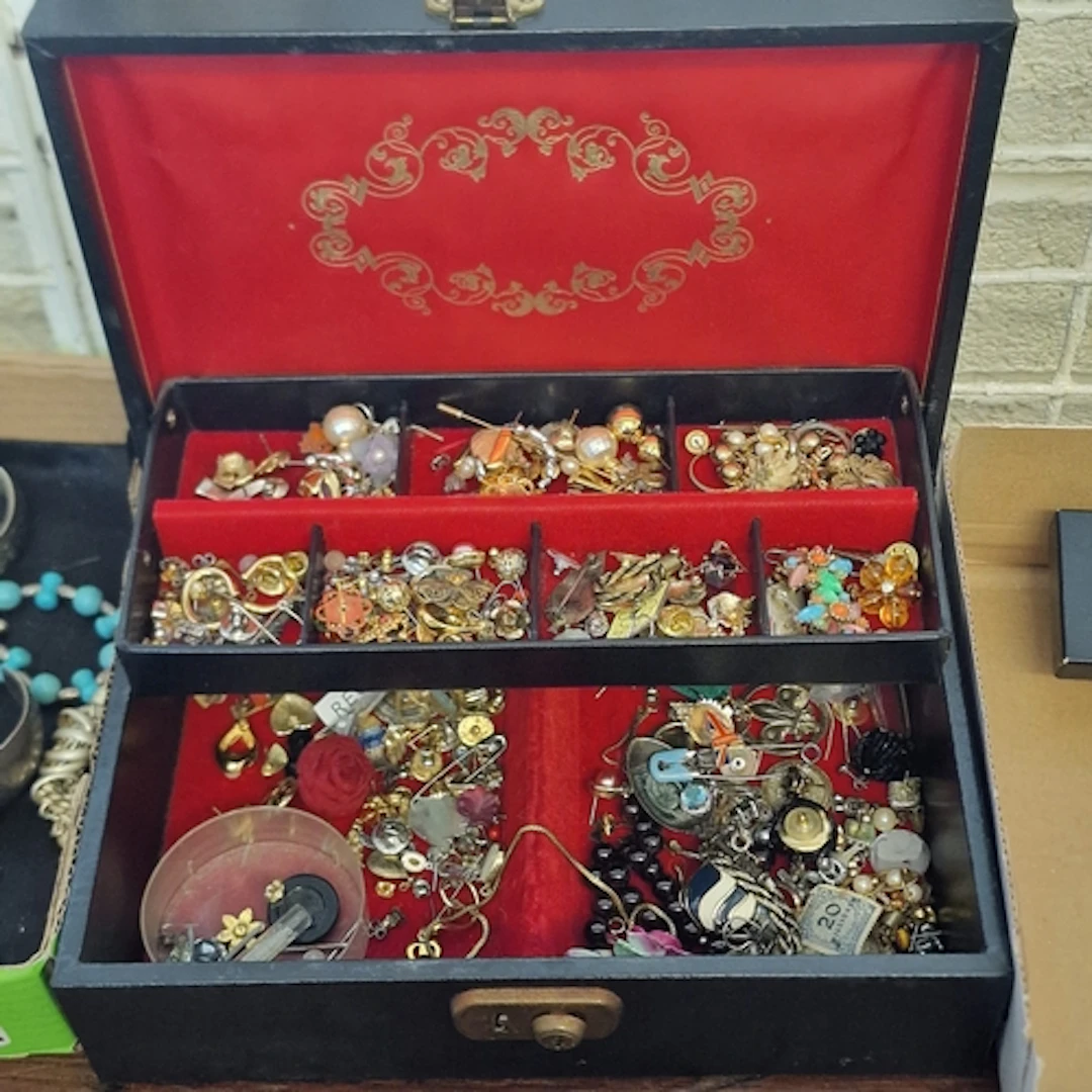 Jewellery box comprising a collection of costume jewellery t...