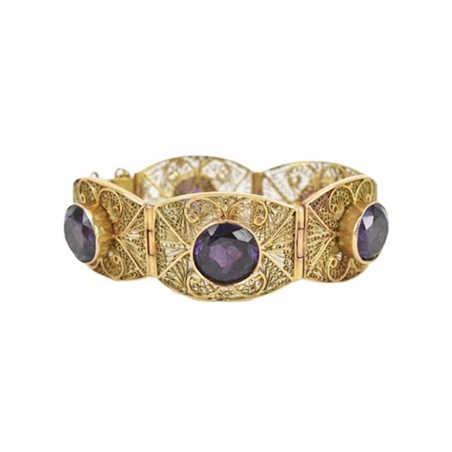 A 12ct gold and gemstone bracelet, formed as five articulate...
