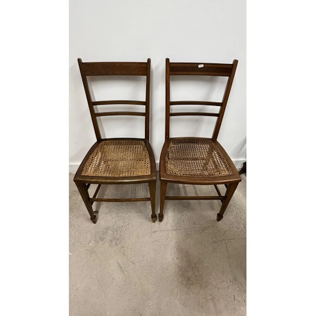 Pair of bedroom chairs with cane seats.