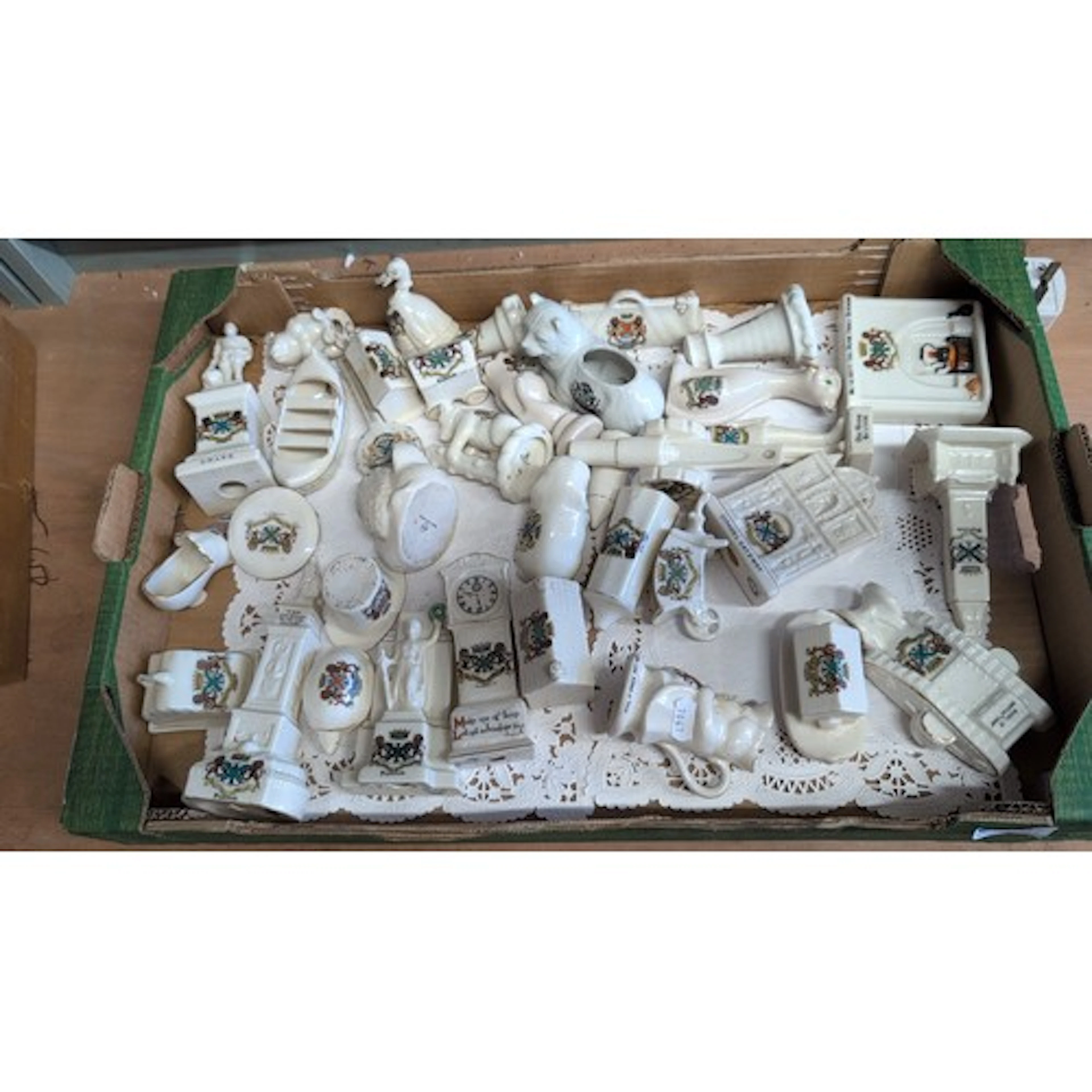 A quantity of commemorative ceramic crested wares, principal...