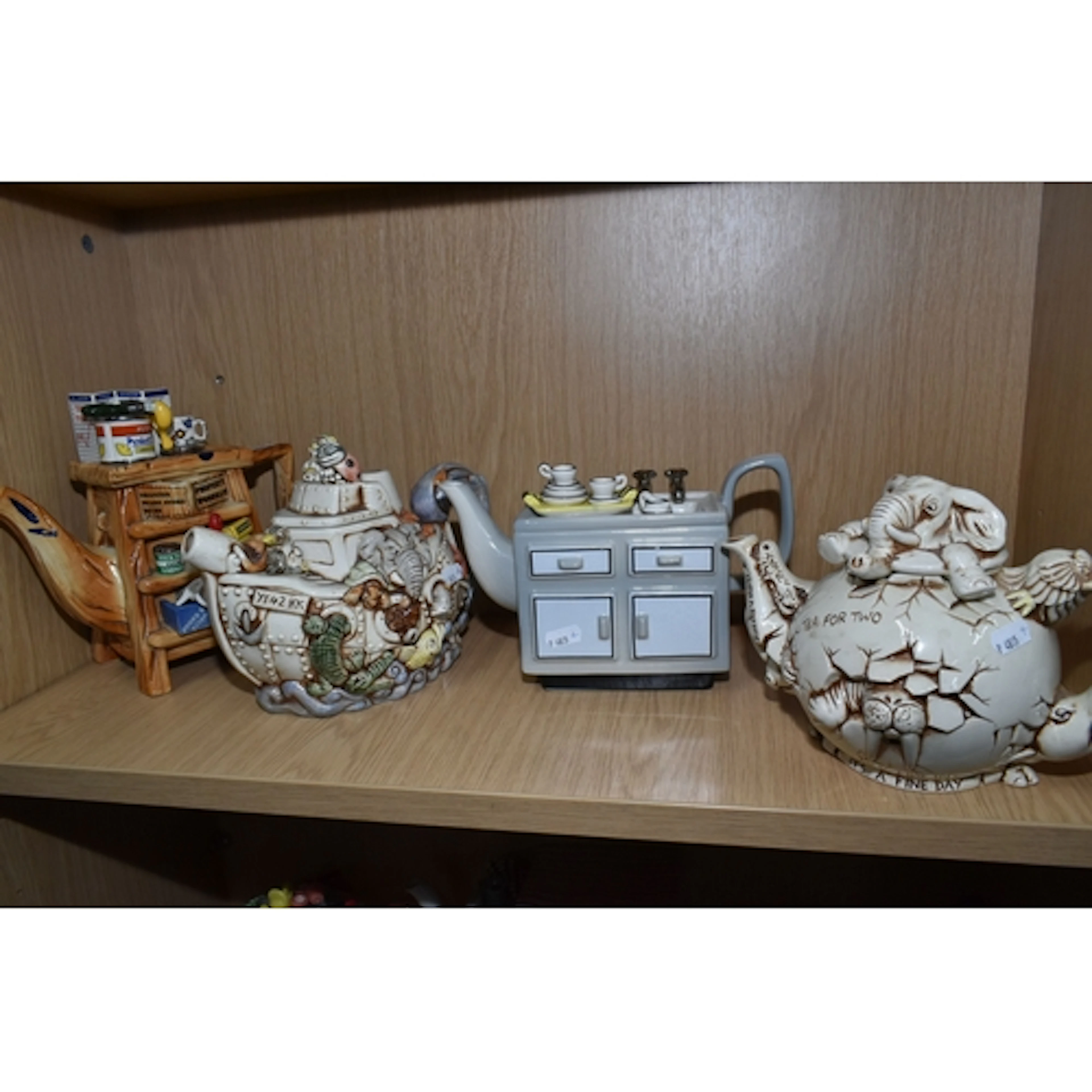 A GROUP OF VINTAGE PAUL CARDEW NOVELTY TEAPOTS, comprising a...