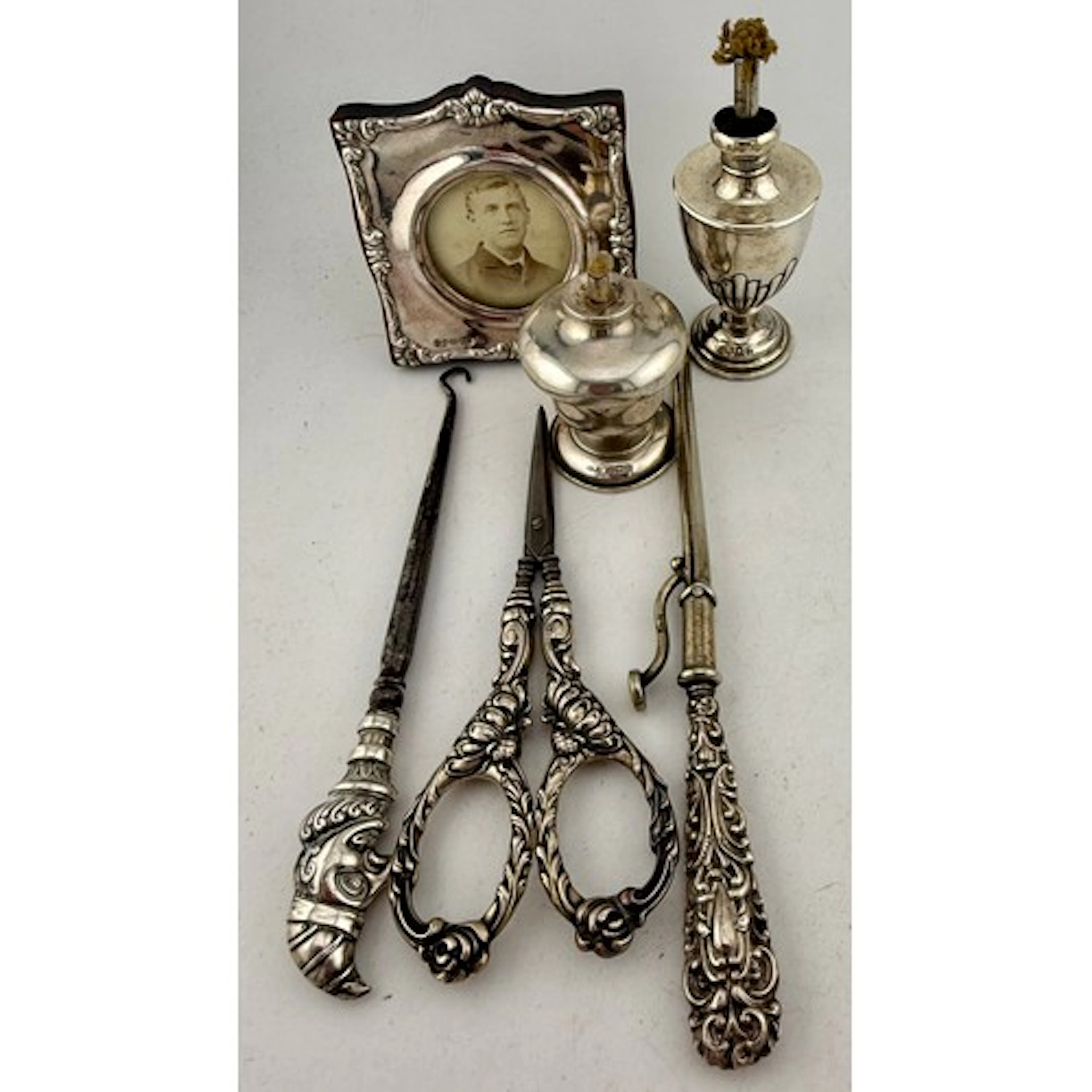 Two hallmarked silver table lighters, sterling silver handle...