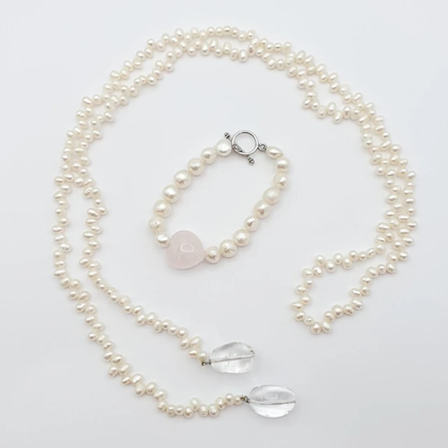 A freshwater Pearl Bracelet with rose quartz heart to its ce...