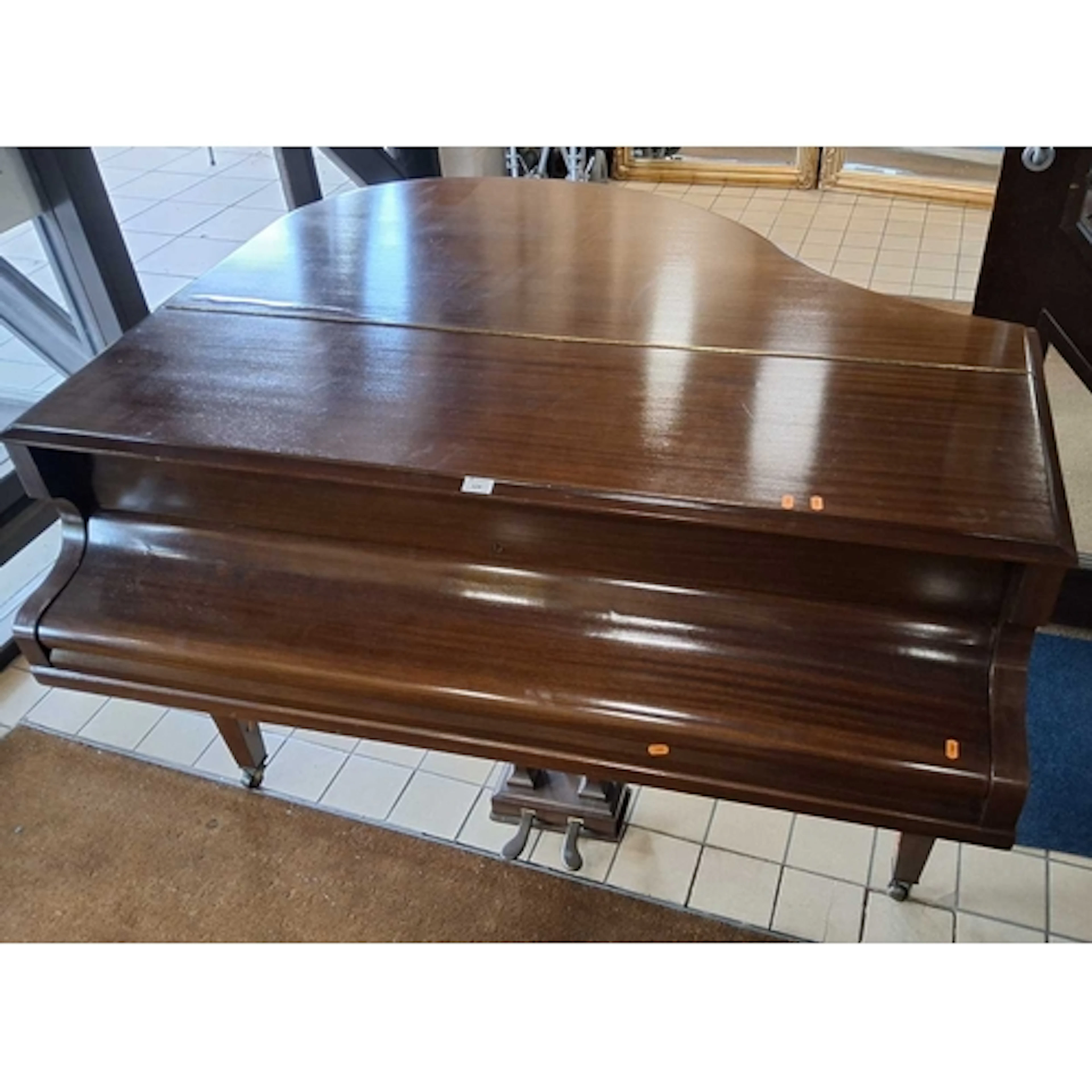 A CHALLEN MAHOGANY PETITE BABY GRAND PIANO, with a hinged li...
