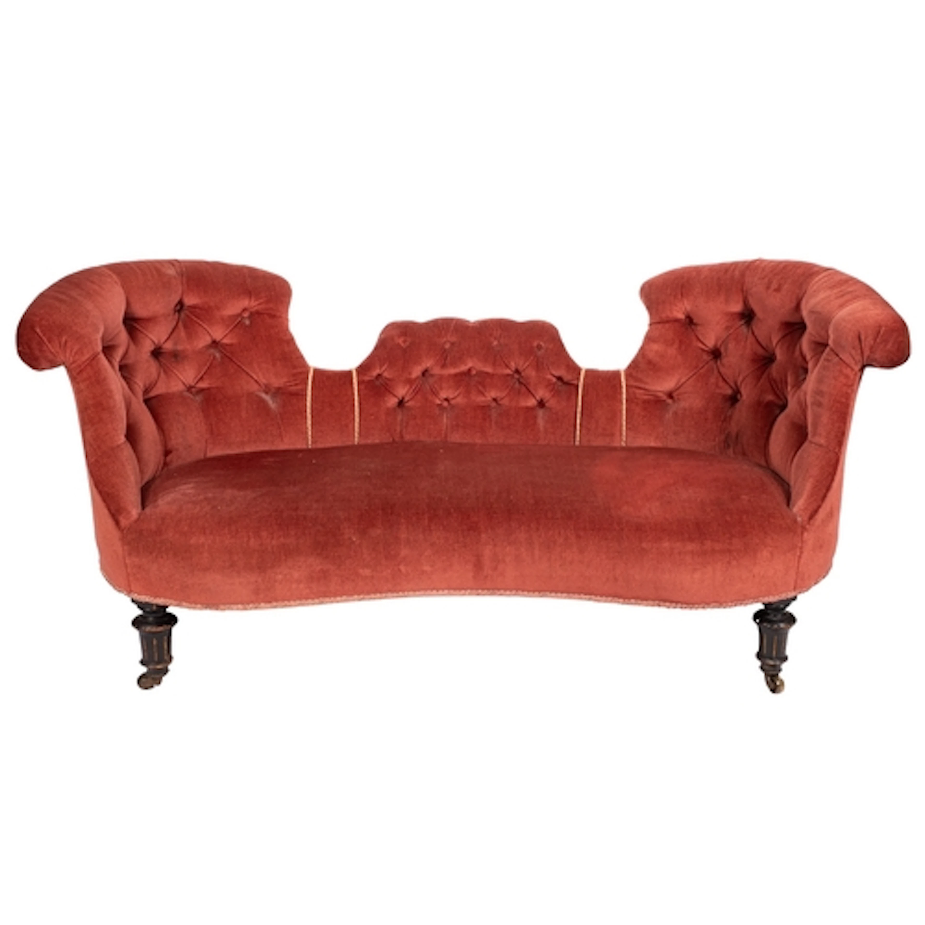 A Victorian upholstered conversation settee, by Gillow & Co....