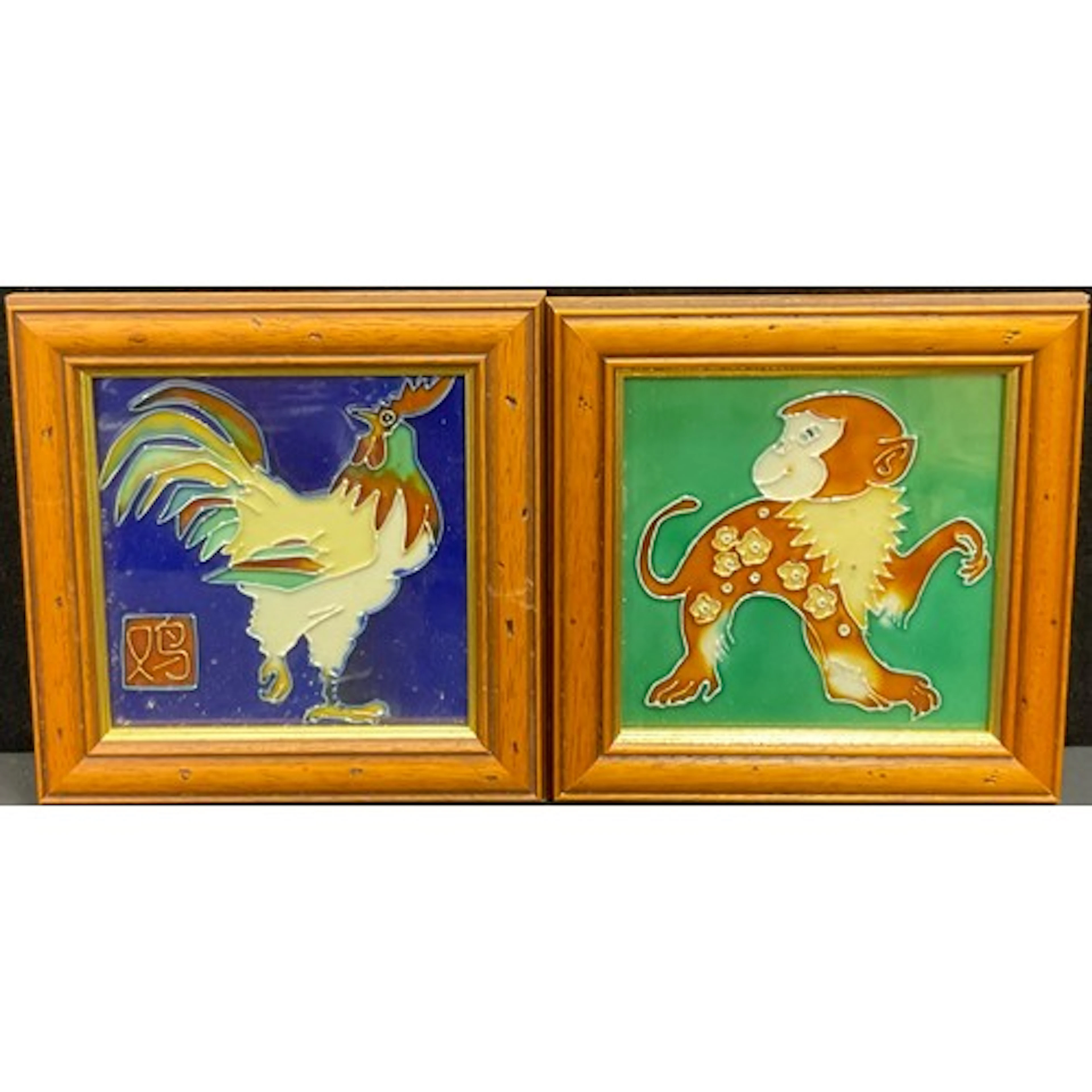 A pair of 20th century ceramic tiles, decorated with Chines...