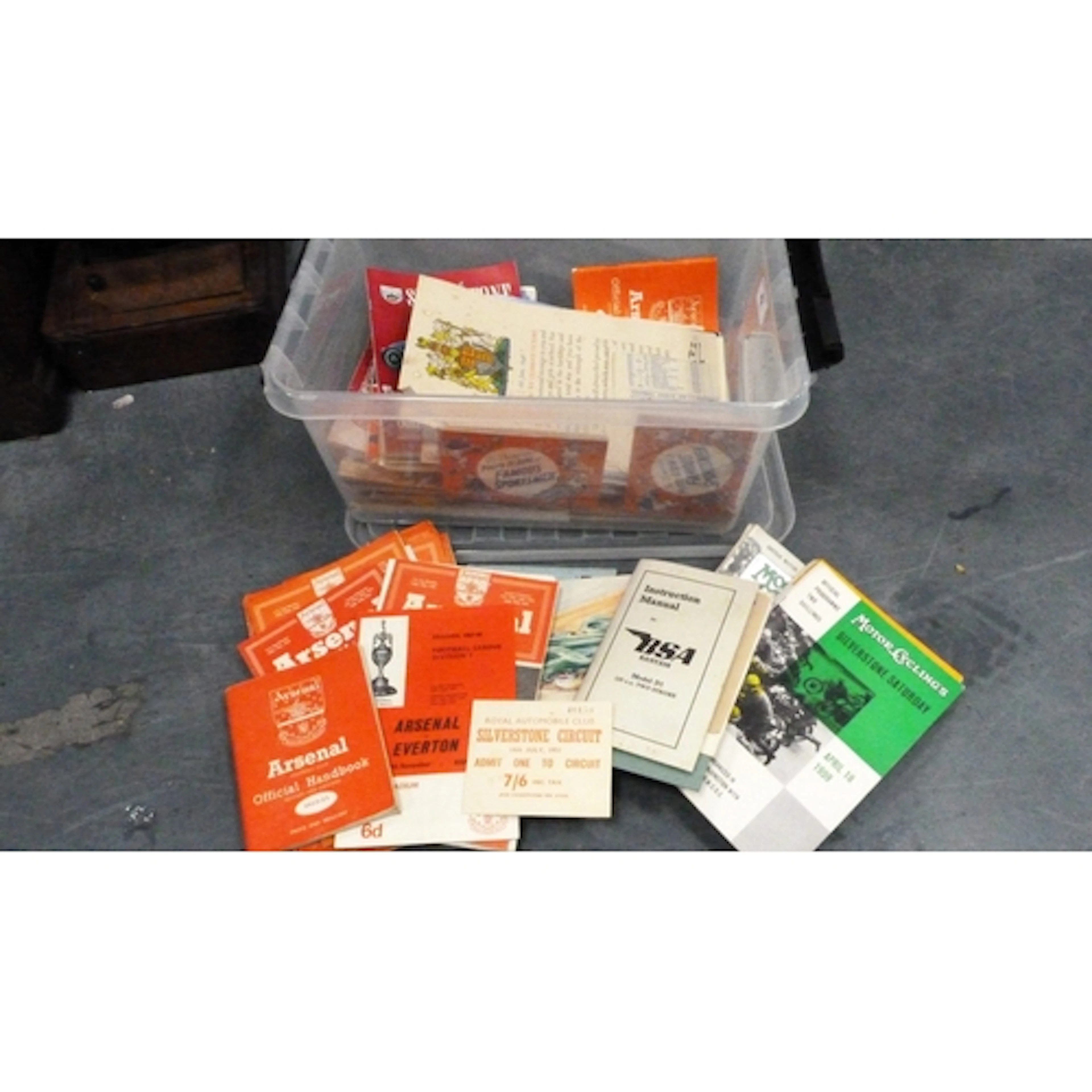 Box containing motorcycle magazines, football handbooks and ...
