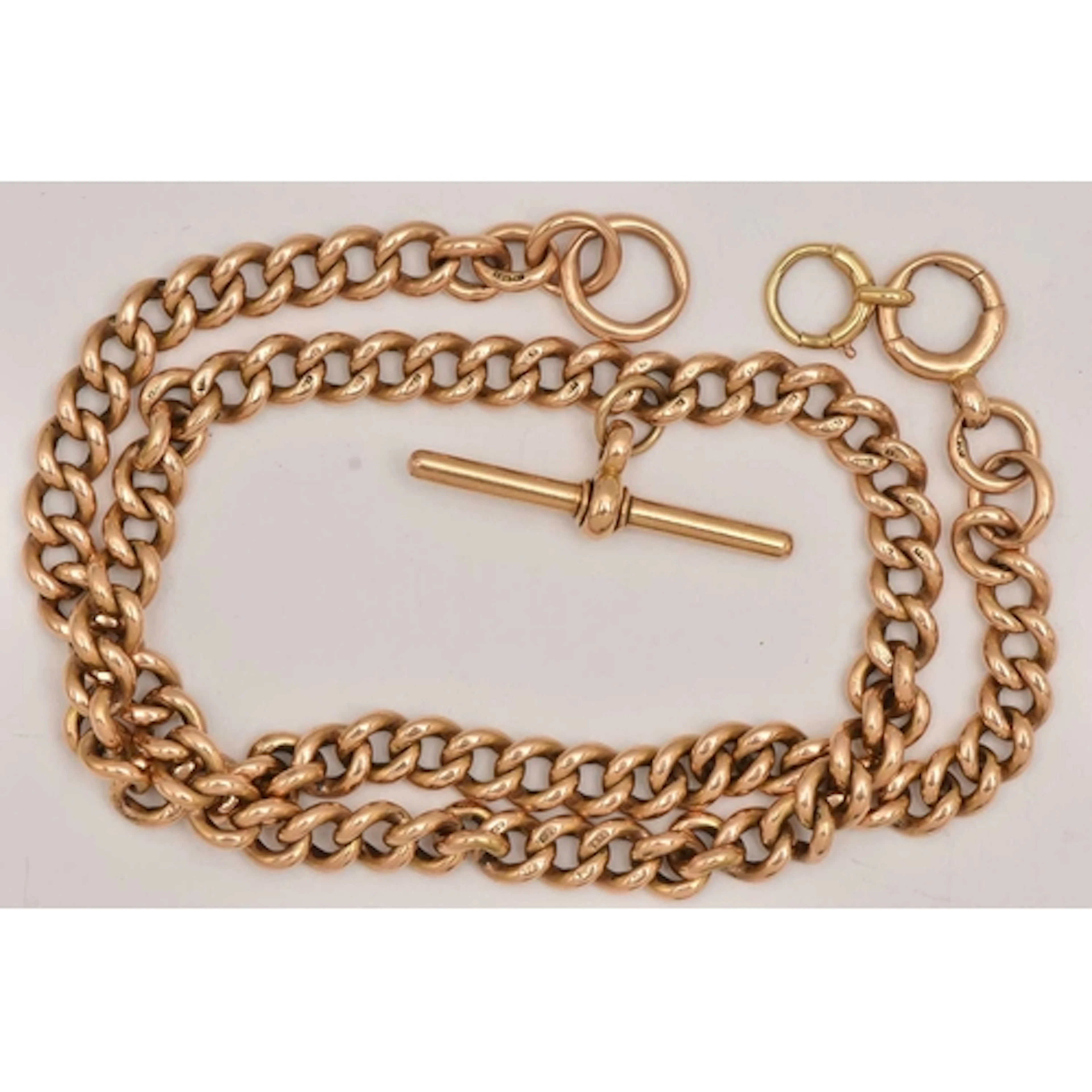 A 15CT YELLOW GOLD ALBERT CHAIN, a curb link chain fitted wi...
