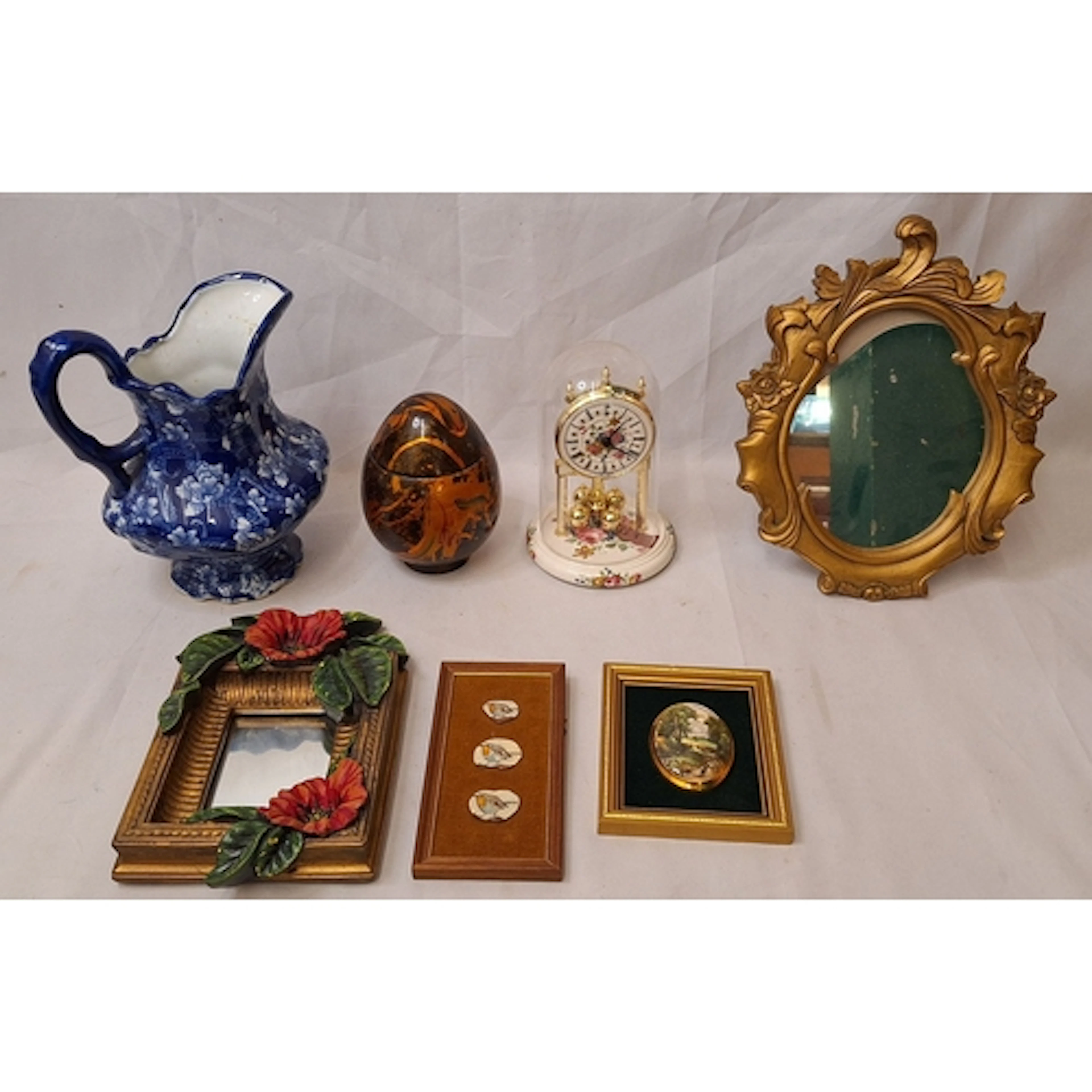 Composition Lacquered Egg shaped box decorated with gold, an...
