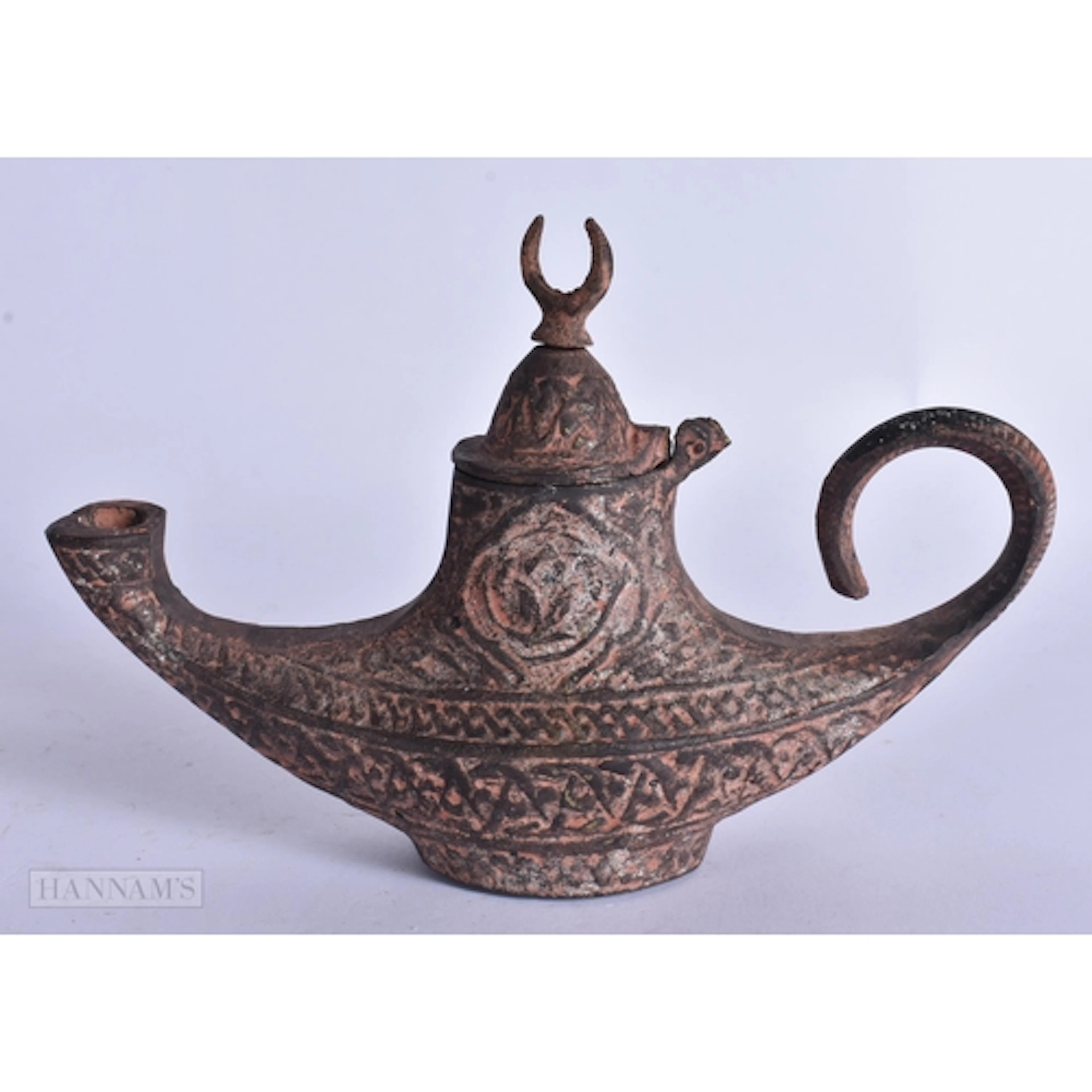 AN ANTIQUE ISLAMIC MIDDLE EASTERN BRONZE LAMP. 18 cm wide.