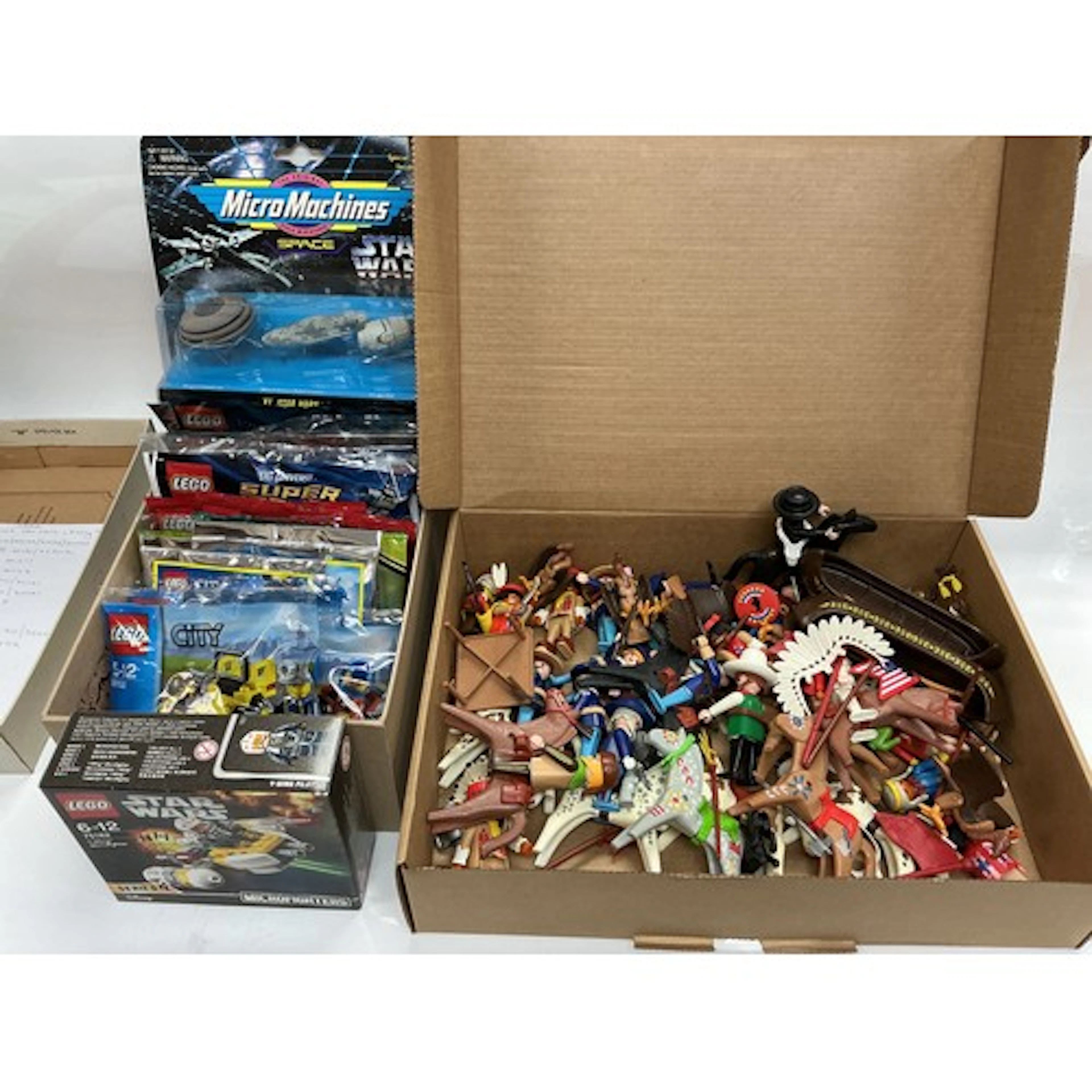 A collection of Lego mini sets, a Playmobil Wild West playse...