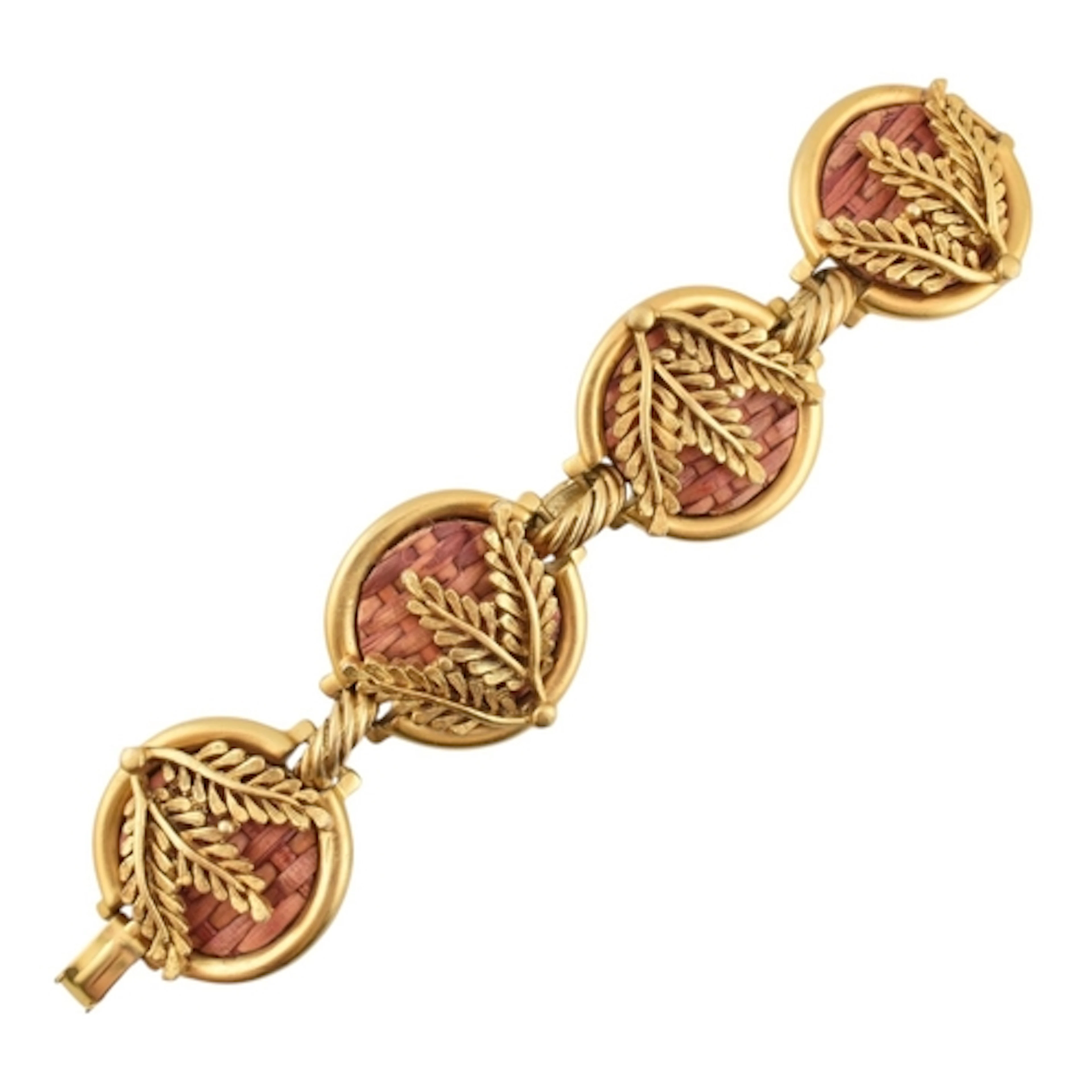 A vintage gold tone and wicker medallion statement bracelet....