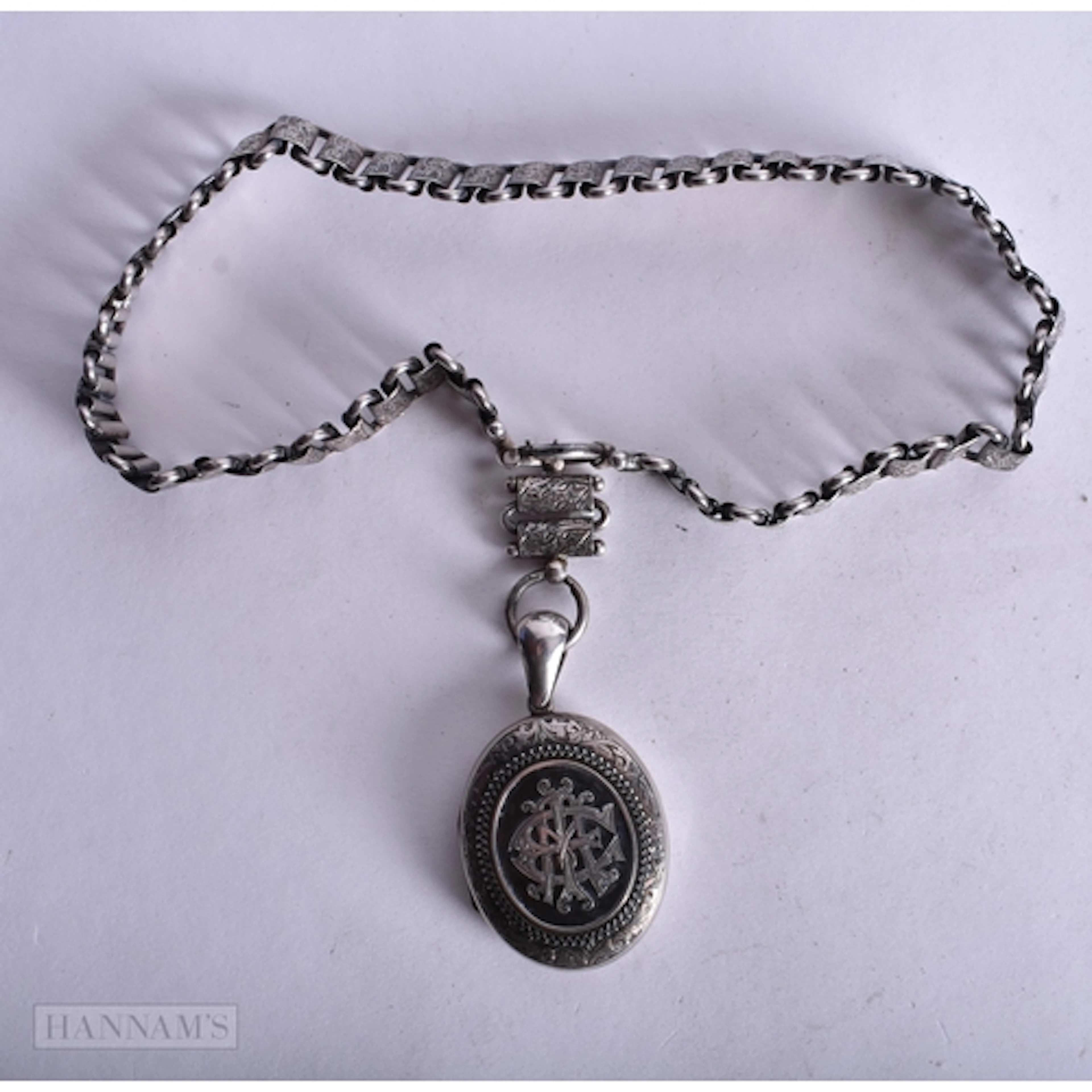 AN EARLY VICTORIAN SILVER LOCKET NECKLACE. 83.9 grams. 42 cm...