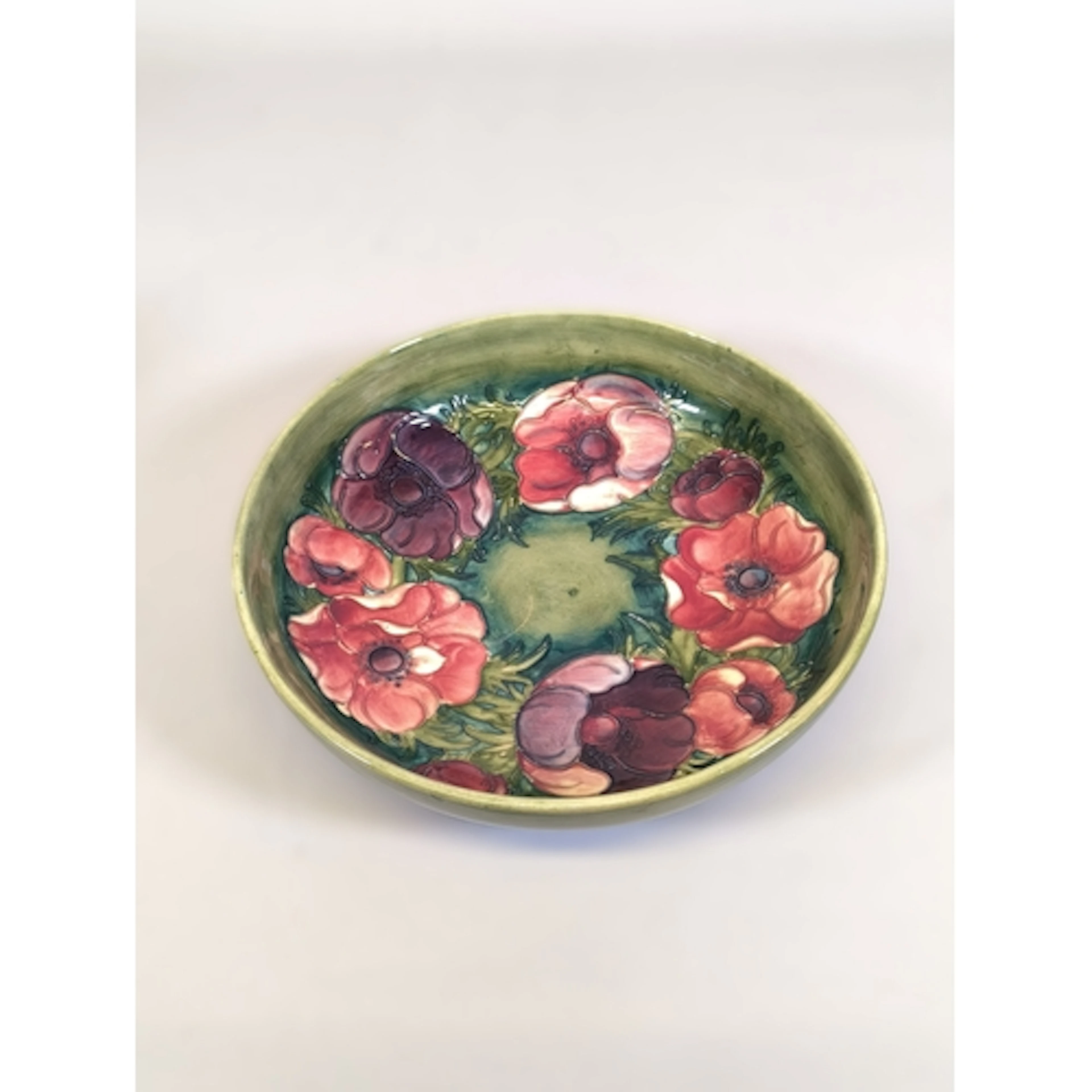 Moorcroft anemone pattern tube lined pottery shallow bowl, o...