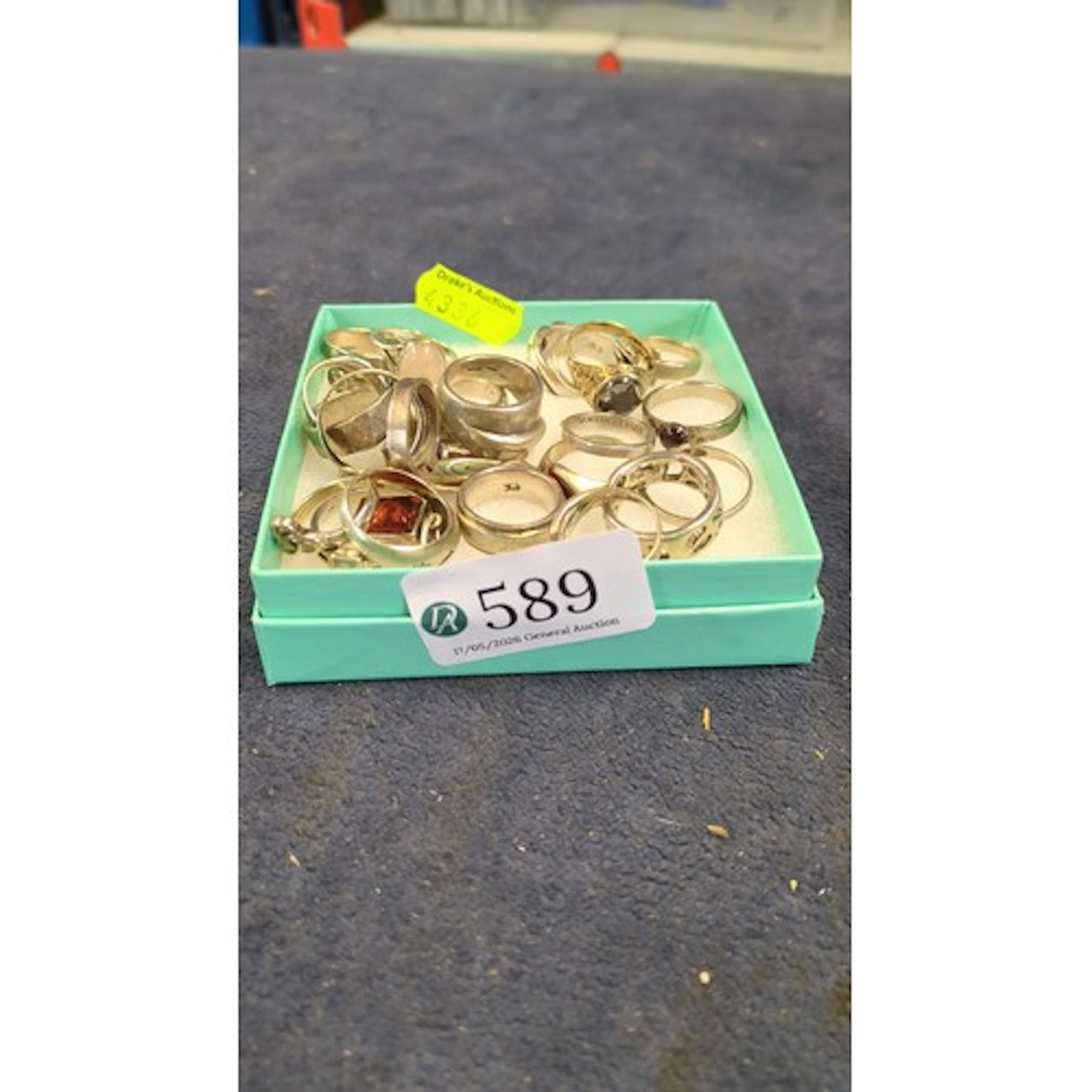 A group of modern silver rings of varied design, including b...