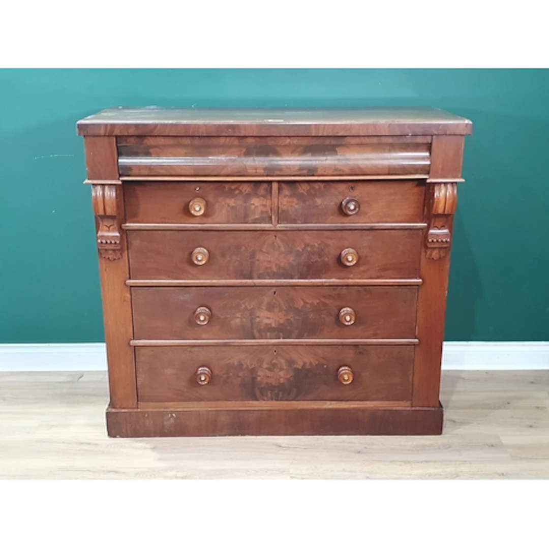 A mahogany Chest of Drawers fitted one long hidden drawer ab...