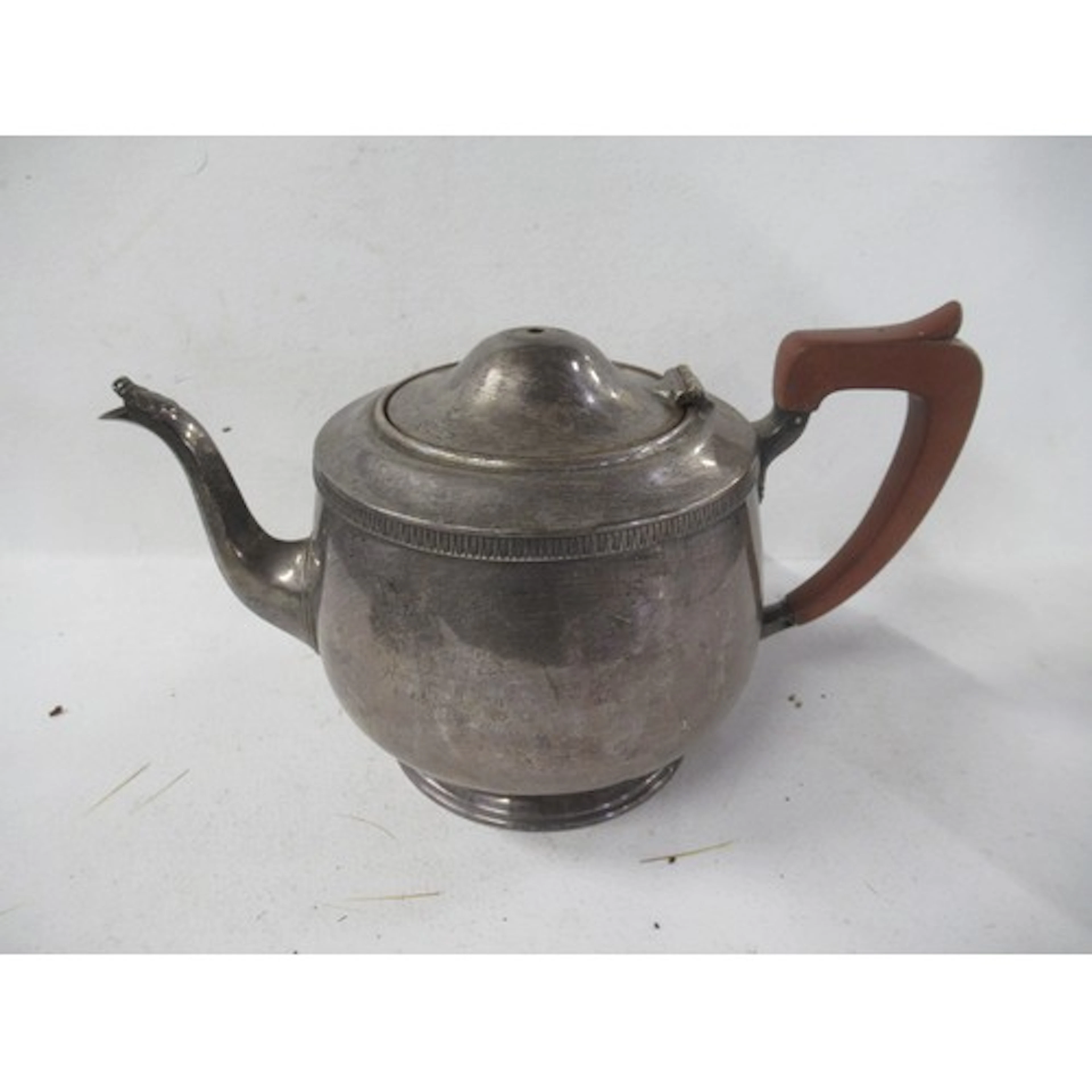 A silver tea pot, weight 17oz all in, together with a silver...