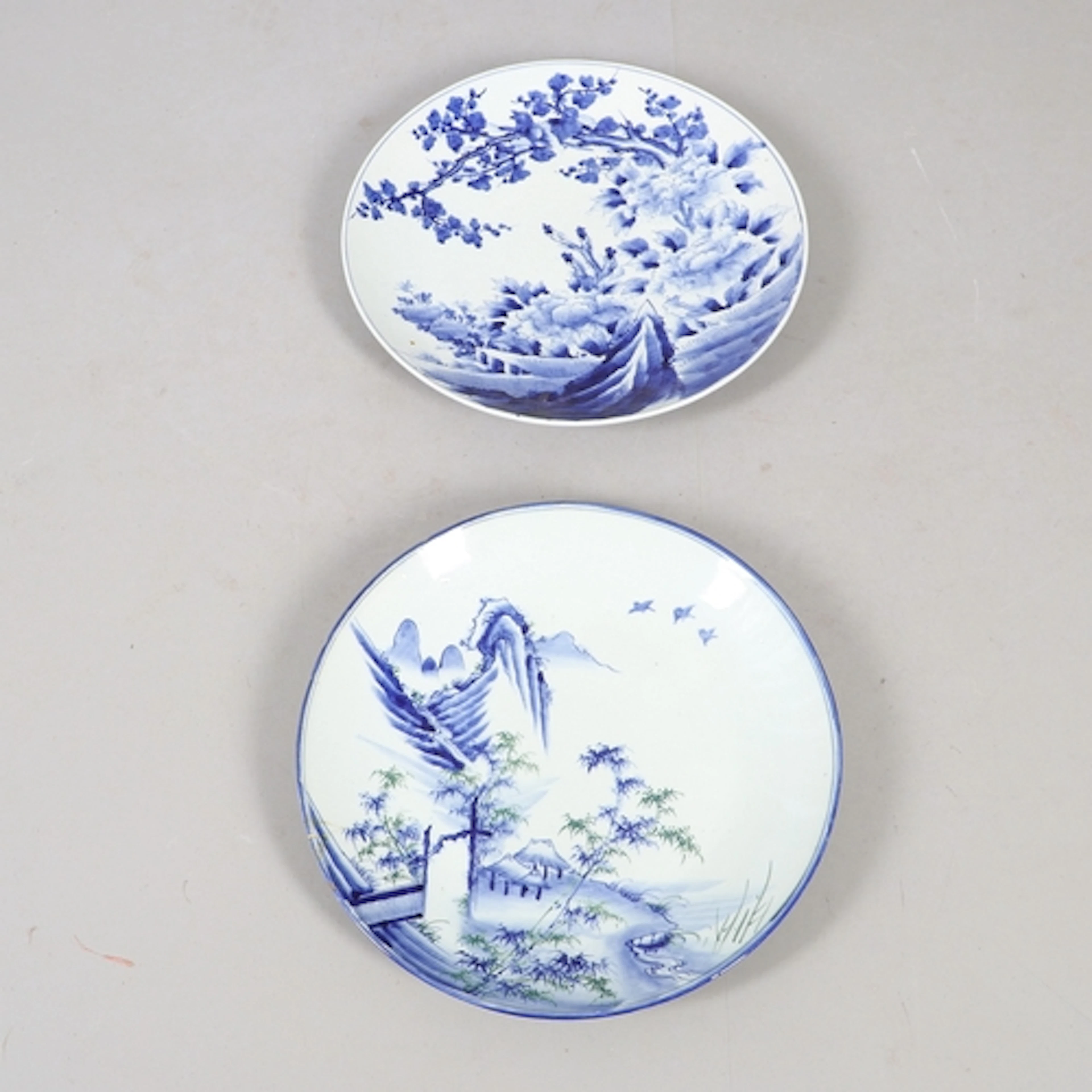 TWO LARGE JAPANESE PORCELAIN CHARGERS. Including a large Ari...