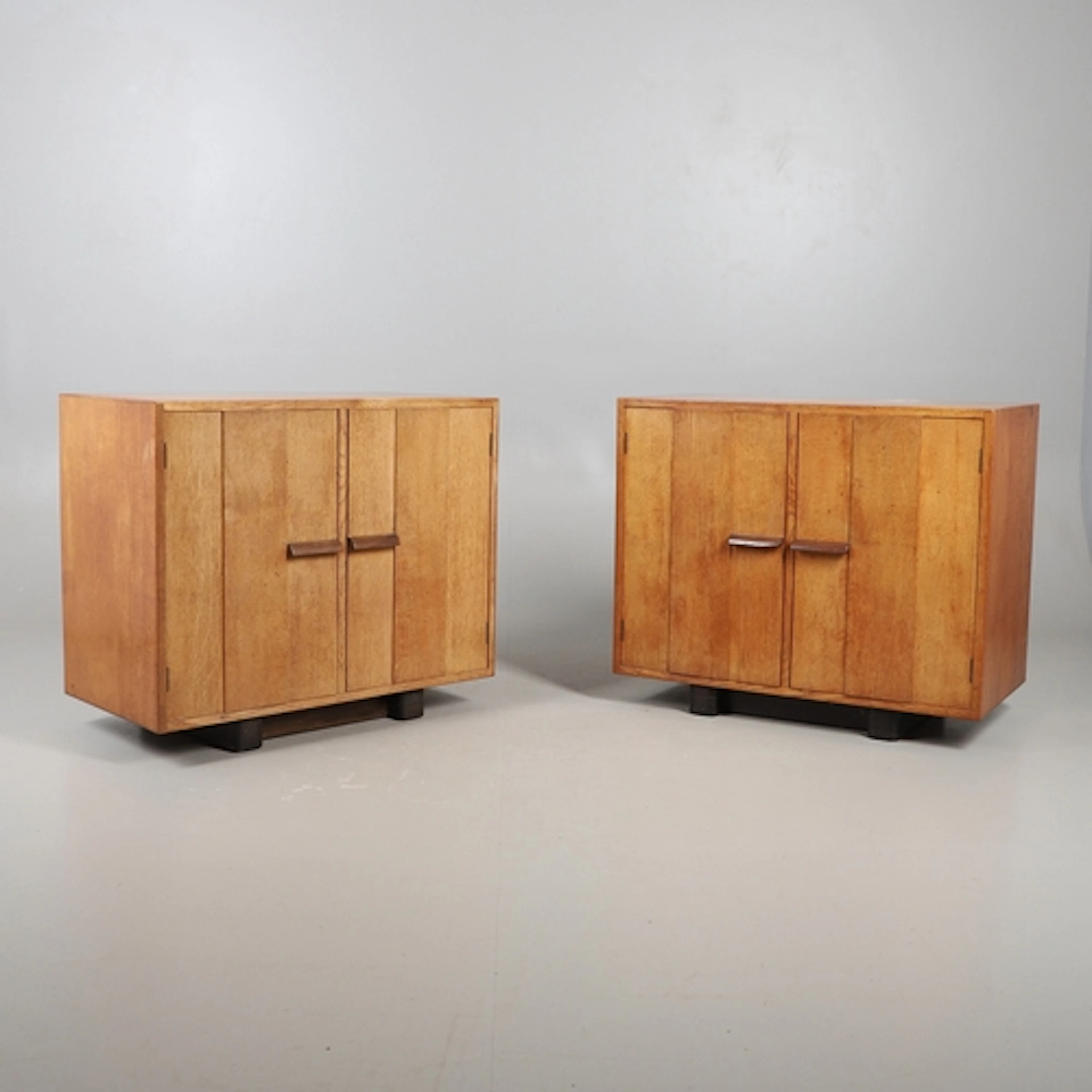 GORDON RUSSELL - PAIR OF COTSWOLD SCHOOL OAK CABINETS. A pai...