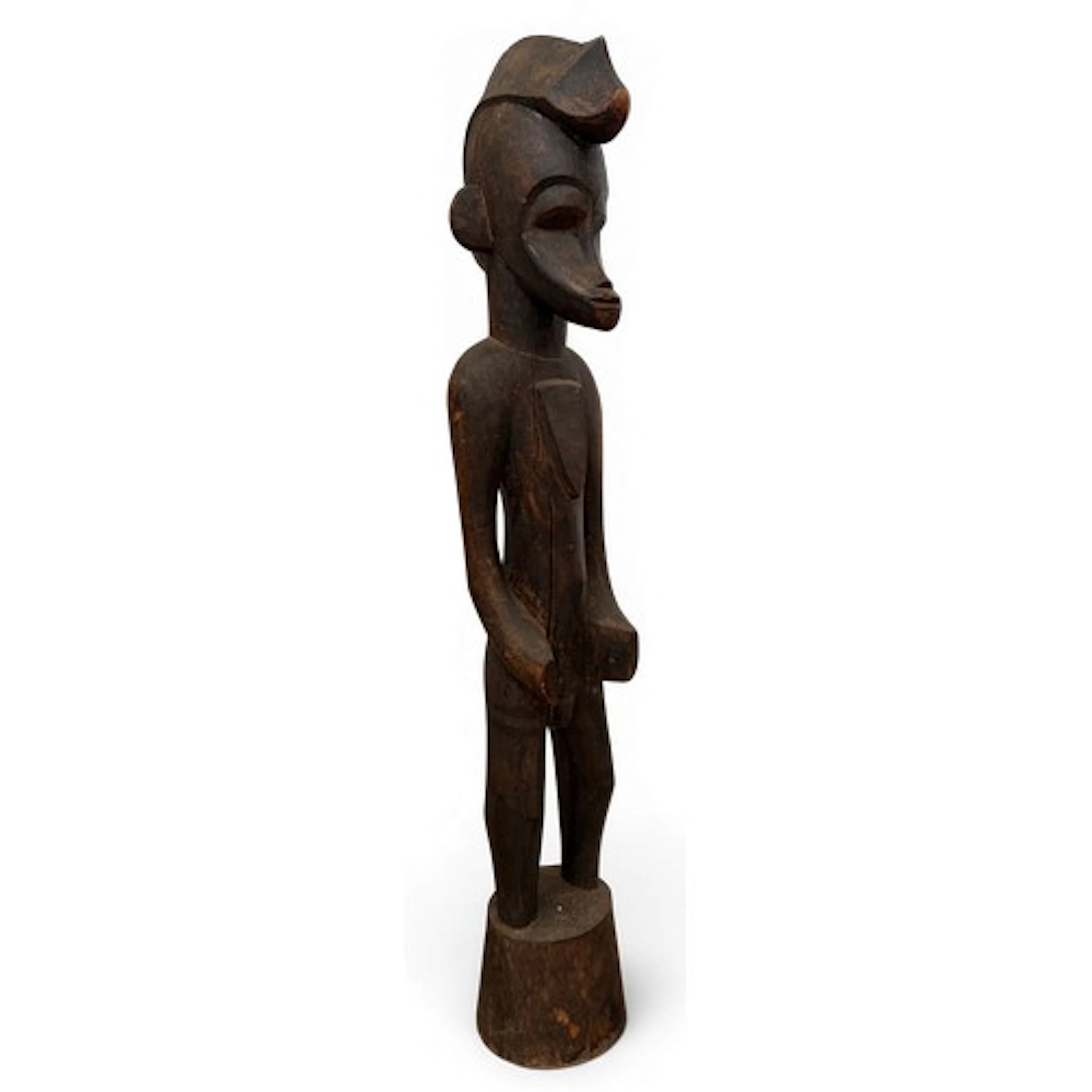 A Senufo grain pounder in the form of a male figure with cre...