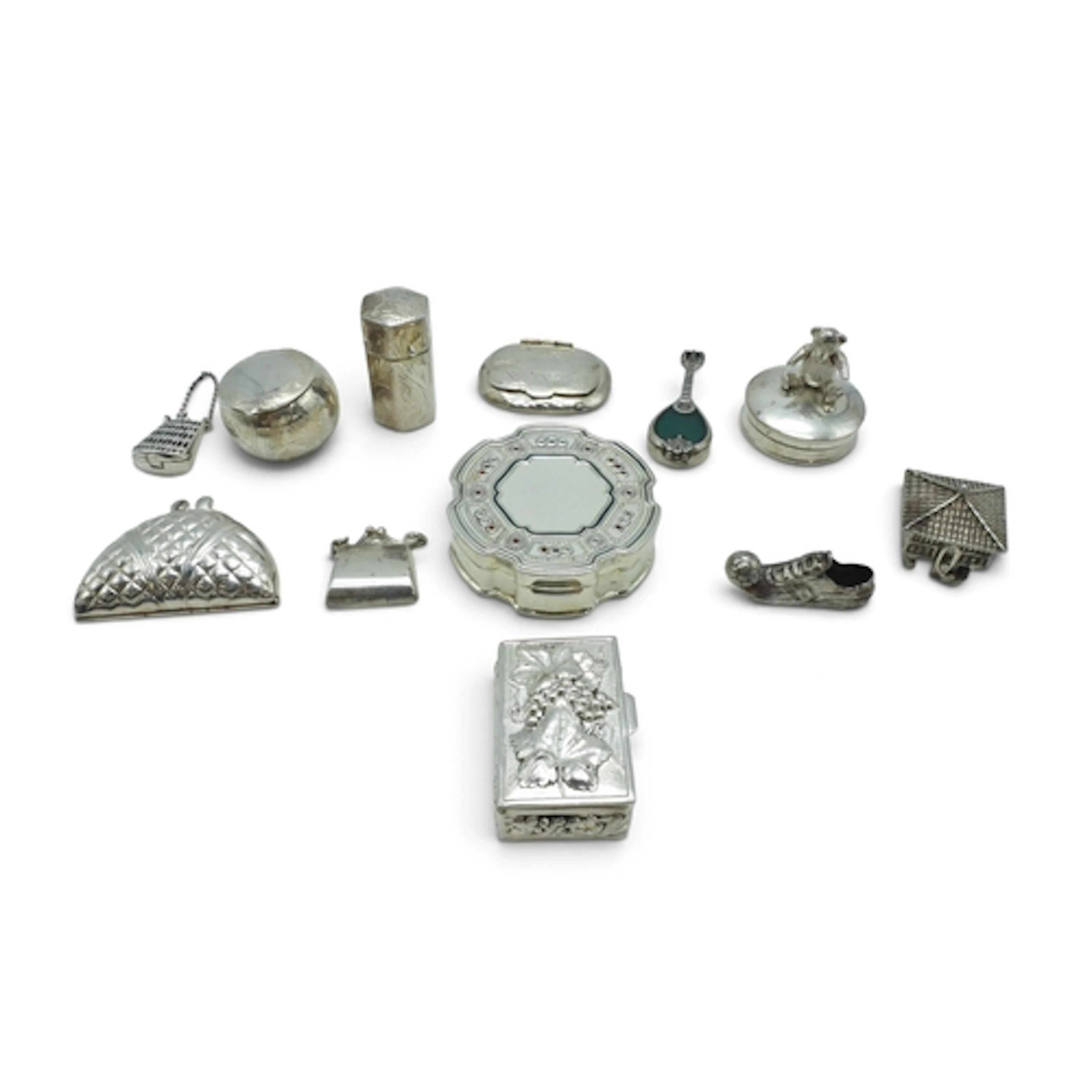 A collection of twelve pill boxes and trinkets, to include a...