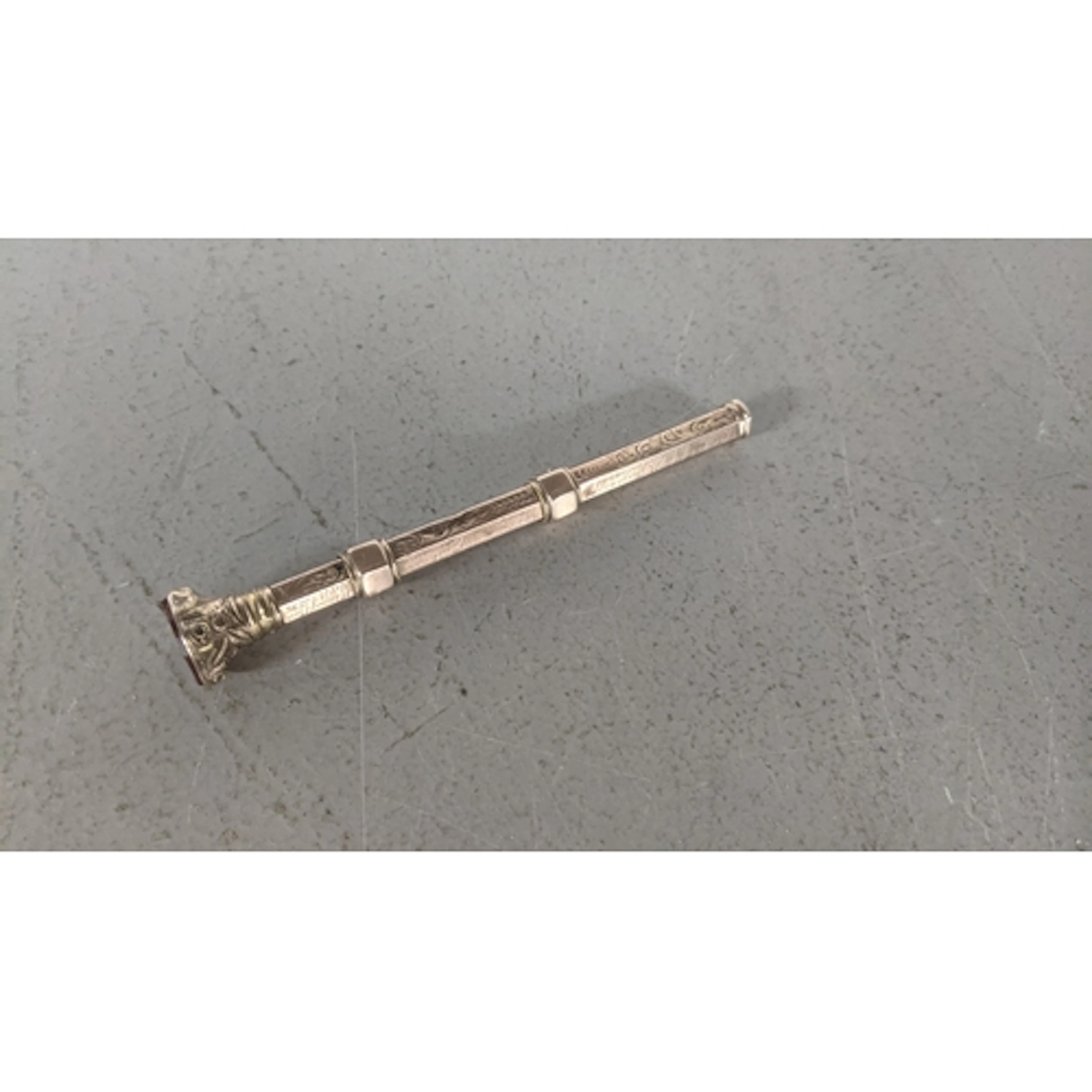 A Victorian rose coloured metal cased vintage propelling pen...