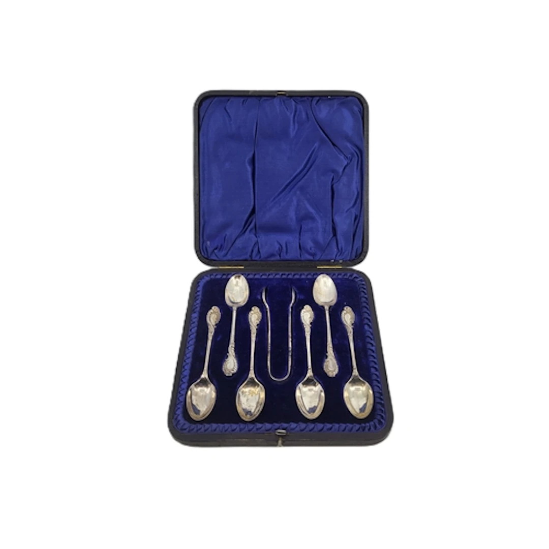 A SET OF SIX SILVER TEA SPOONS AND TONGS, by Walker & Hall, ...