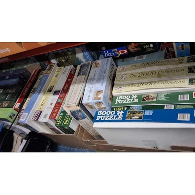 FIVE BOXES OF JIGSAW PUZZLES, approximately forty-five, with...