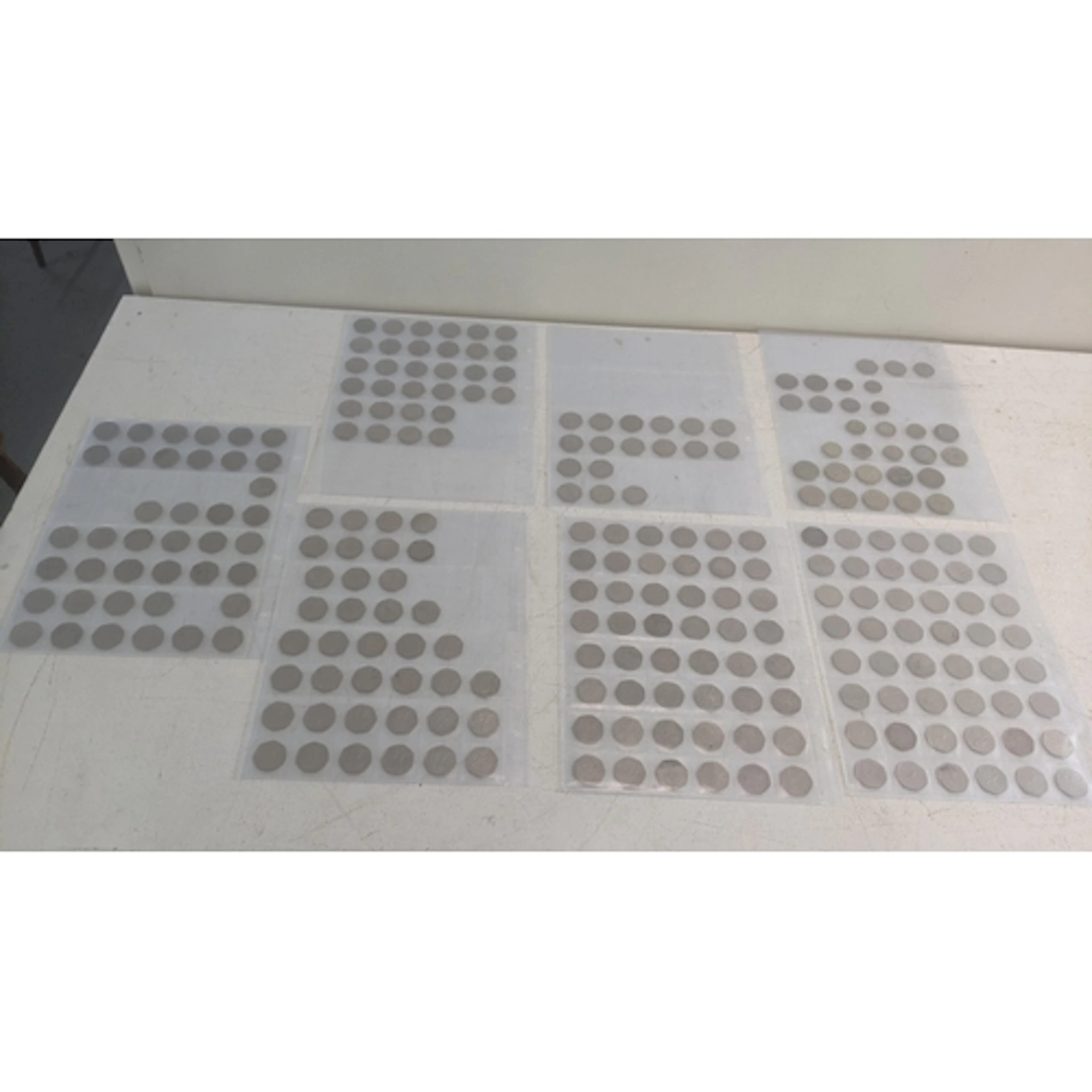 7 coin sleeves containing 258 commemorative 50p and £2 coins...