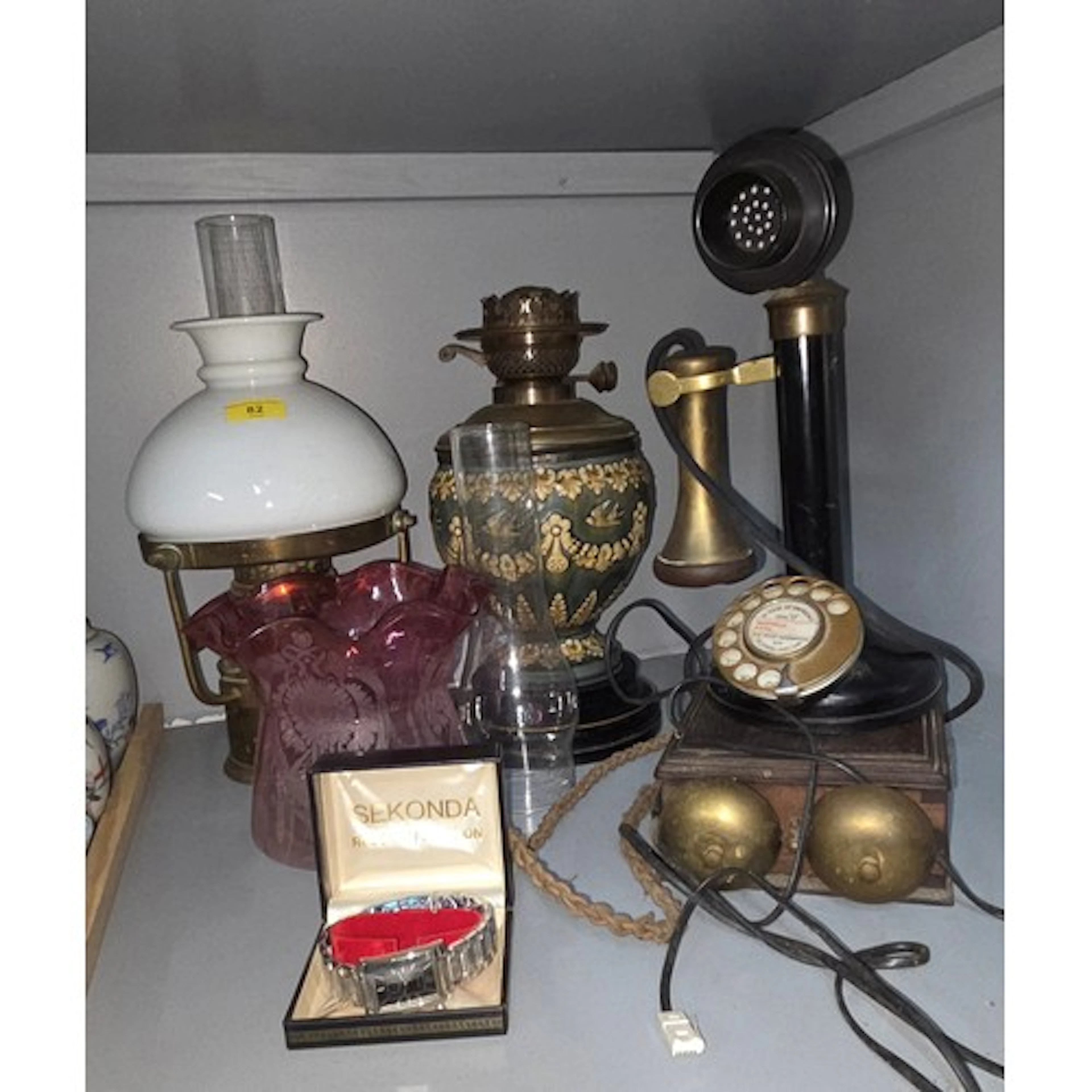 A Royal Doulton-style lamp, a candlestick telephone, a lamp,...