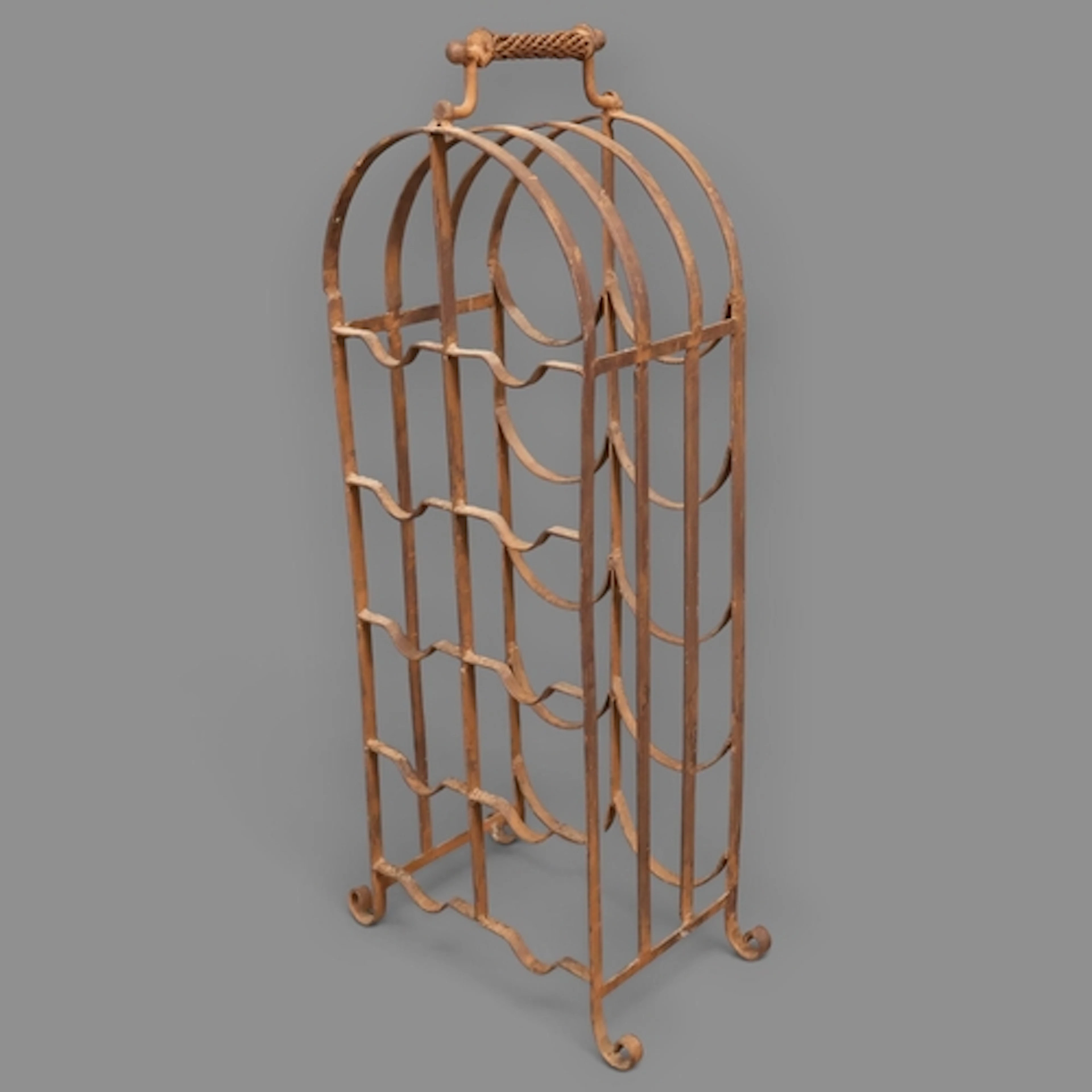 A vintage wrought iron ten-bottle wine rack. H70cm.