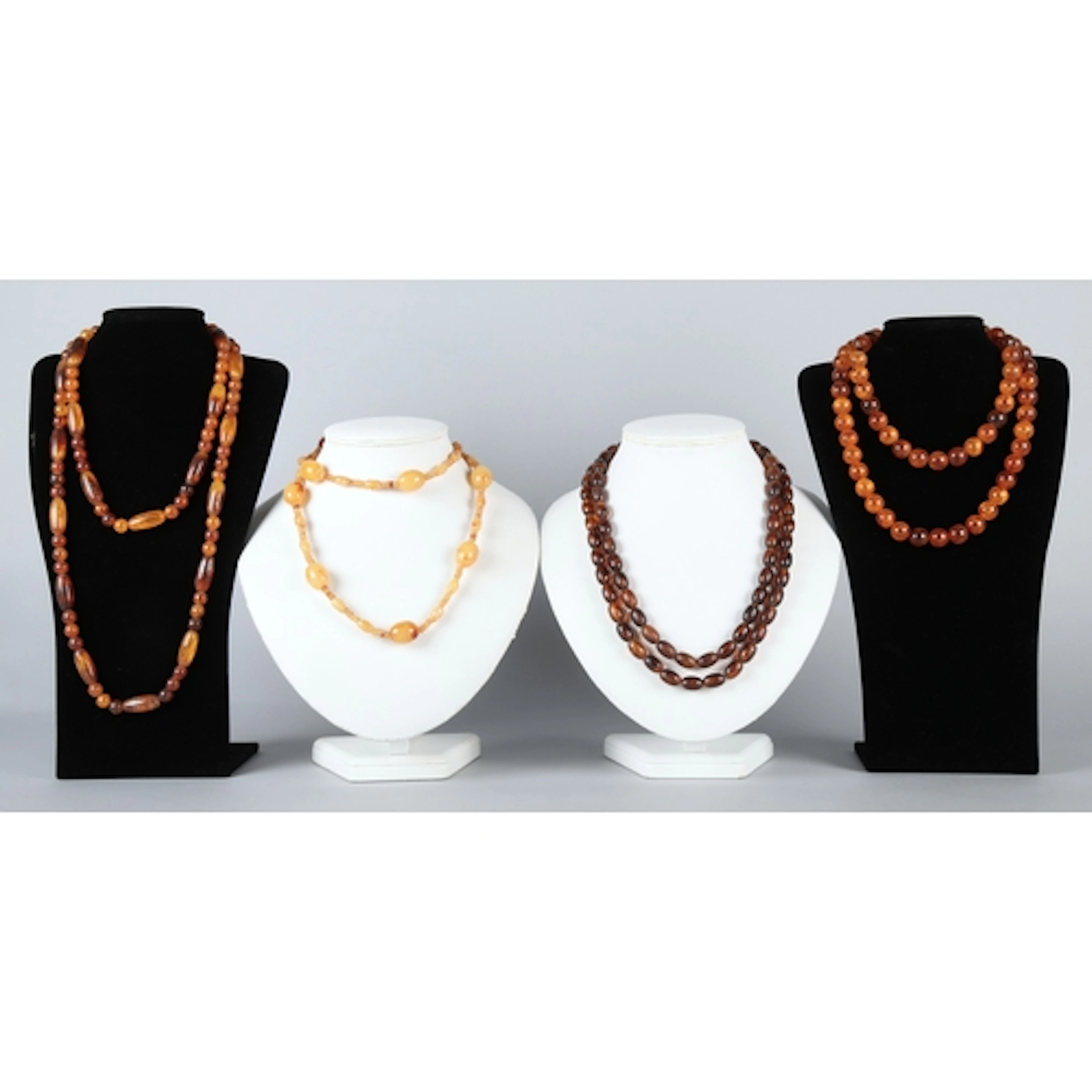 Four strings of Baltic amber beads to include a Butterscotch...