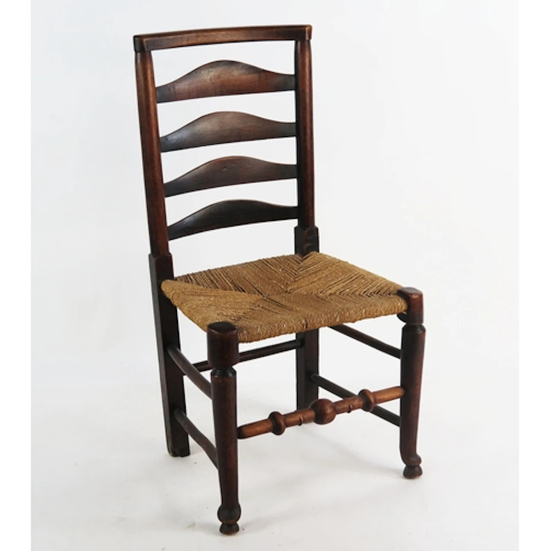 A stained beech chair, with ladder back and sisal seat, the ...