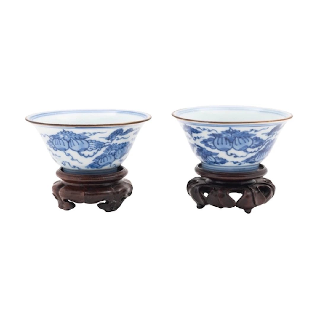 A pair of Chinese blue and white cups, Kangxi period each of...