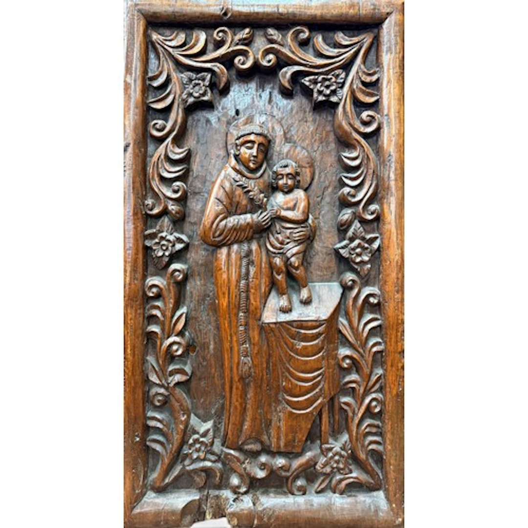 A large Goan carved hardwood panel of Saint Anthony of Padua...