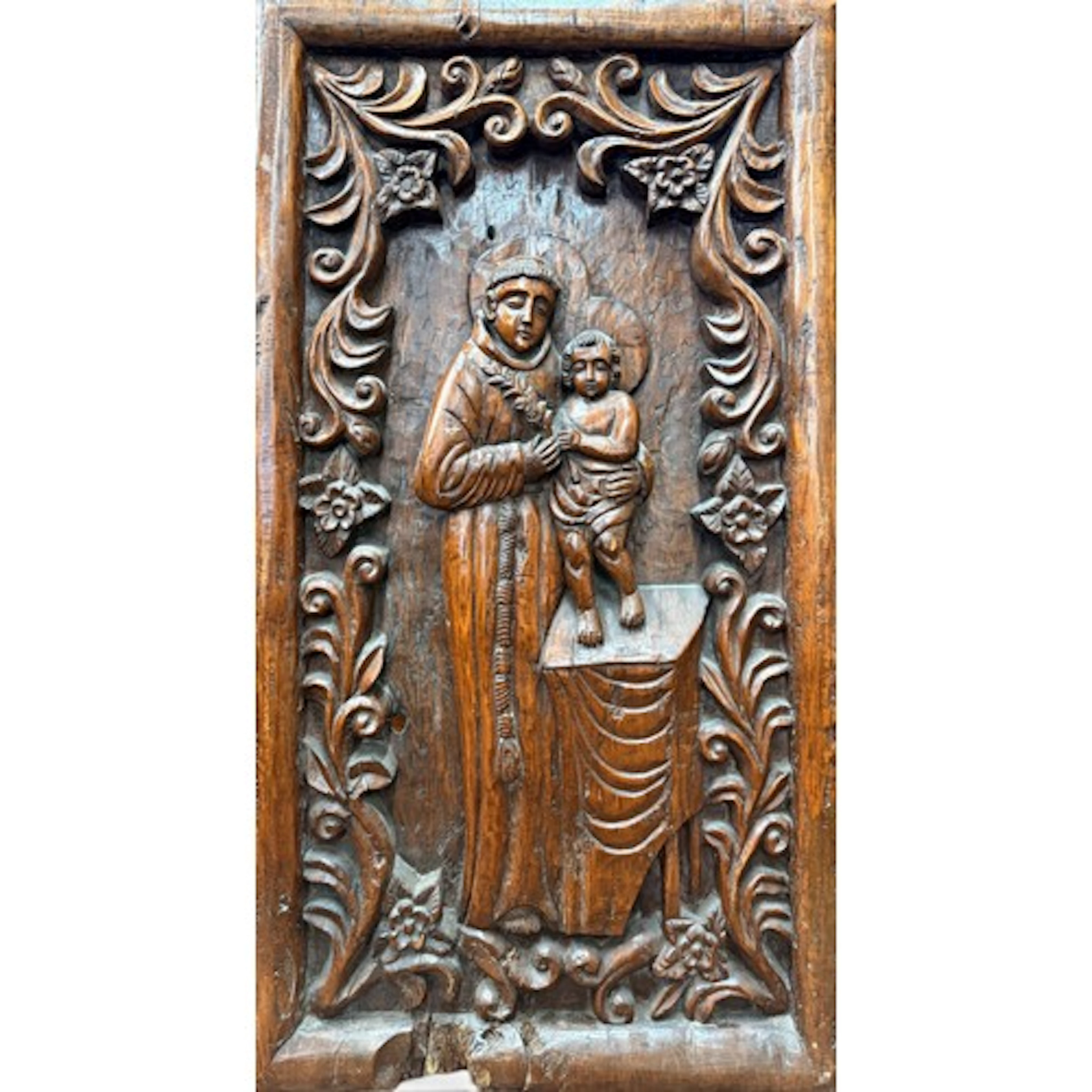 A large Goan carved hardwood panel of Saint Anthony of Padua...