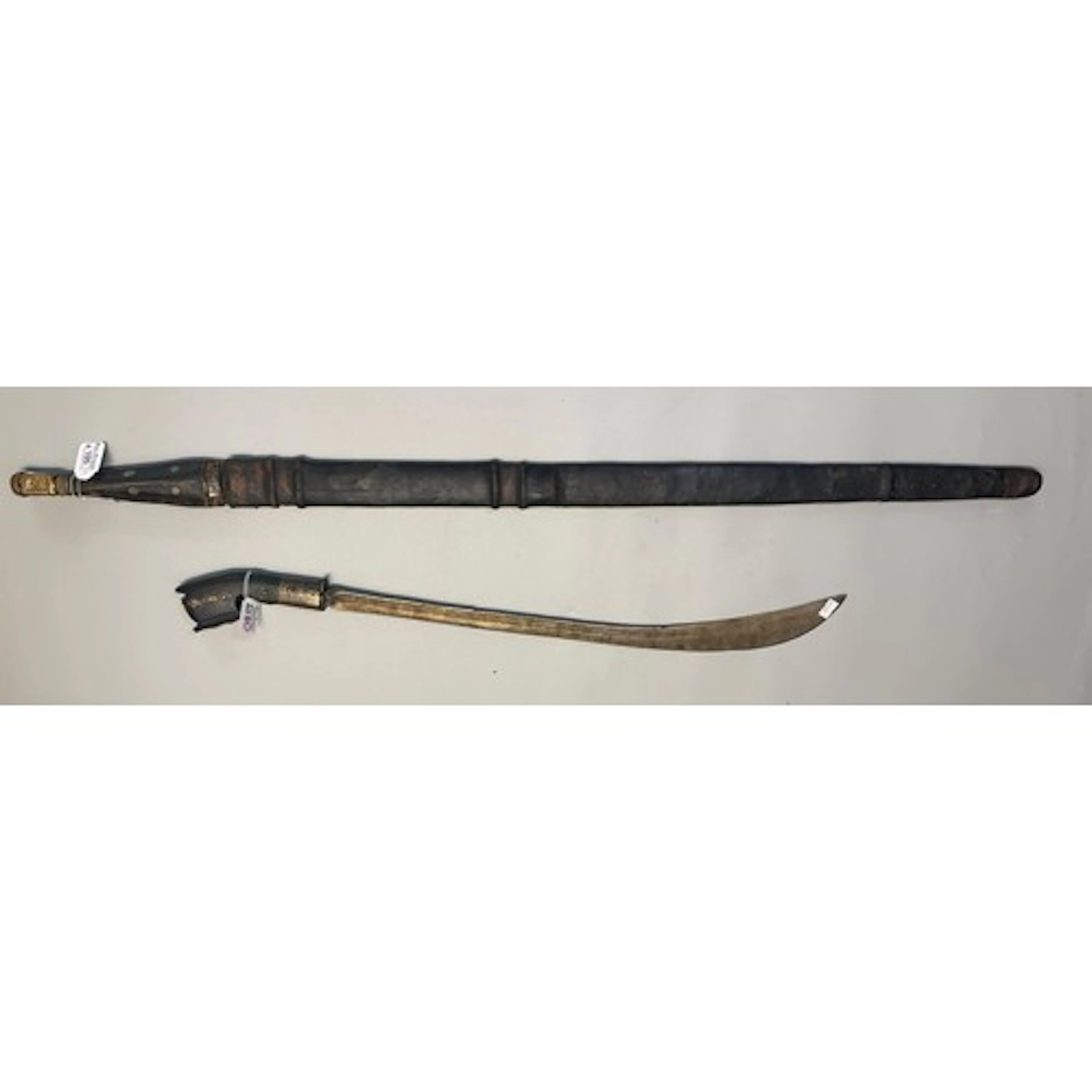 Two swords, comprising an Omani Kattara with long double-edg...