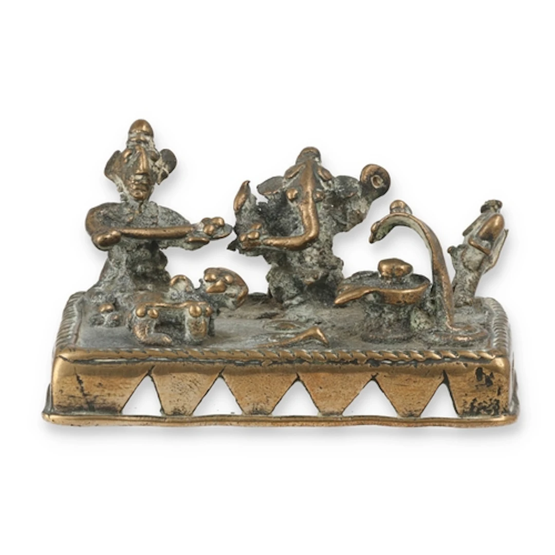 A 19TH C SOUTH INDIAN SMALL BRASS SHRINE SHOWING GANESH, NAN...
