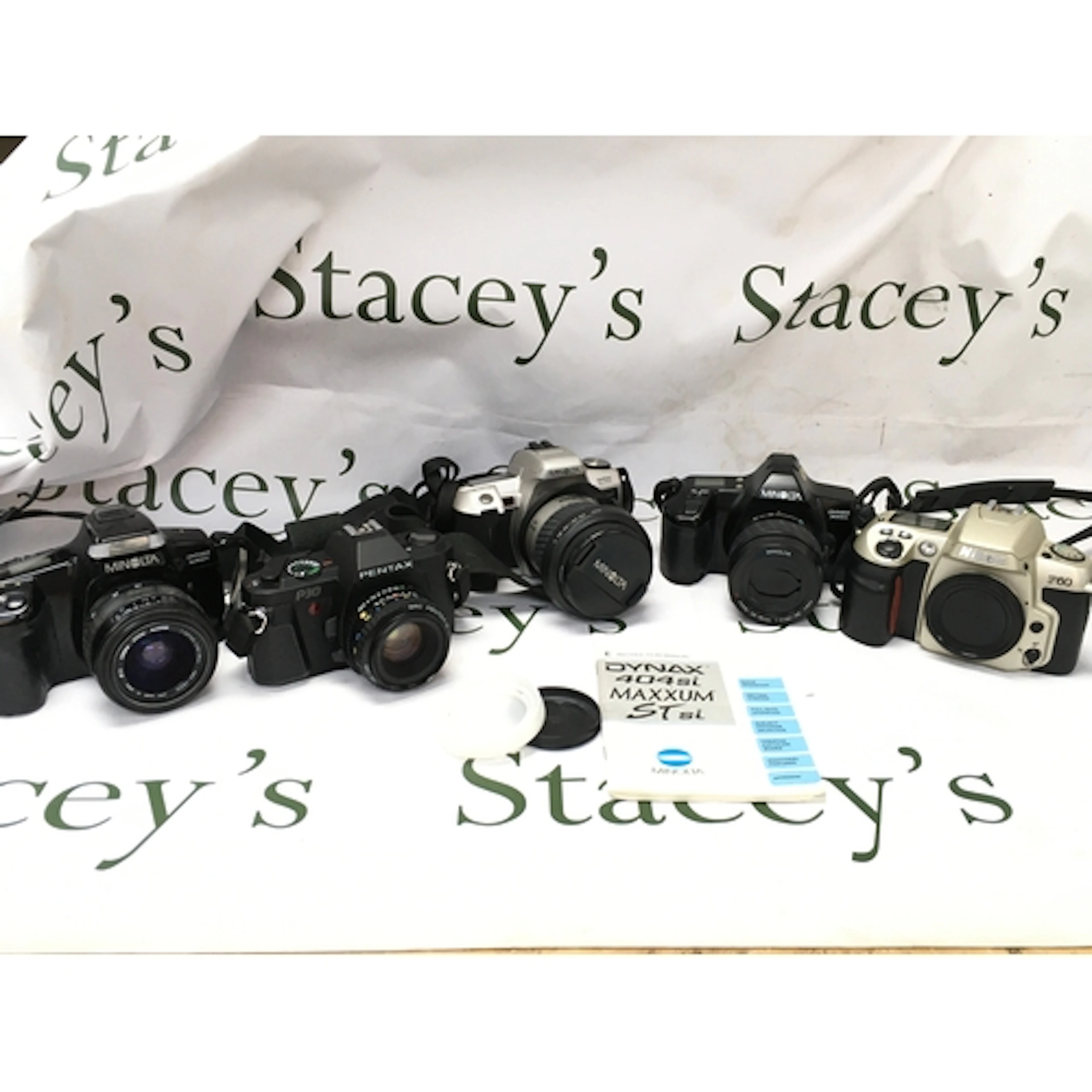 Five vintage SLR cameras, Canon, Minolta, Nikon etc