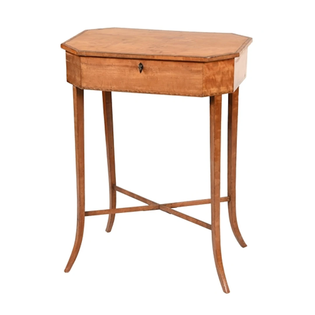 A Regency satinwood and crossbanded work table, with fitted ...