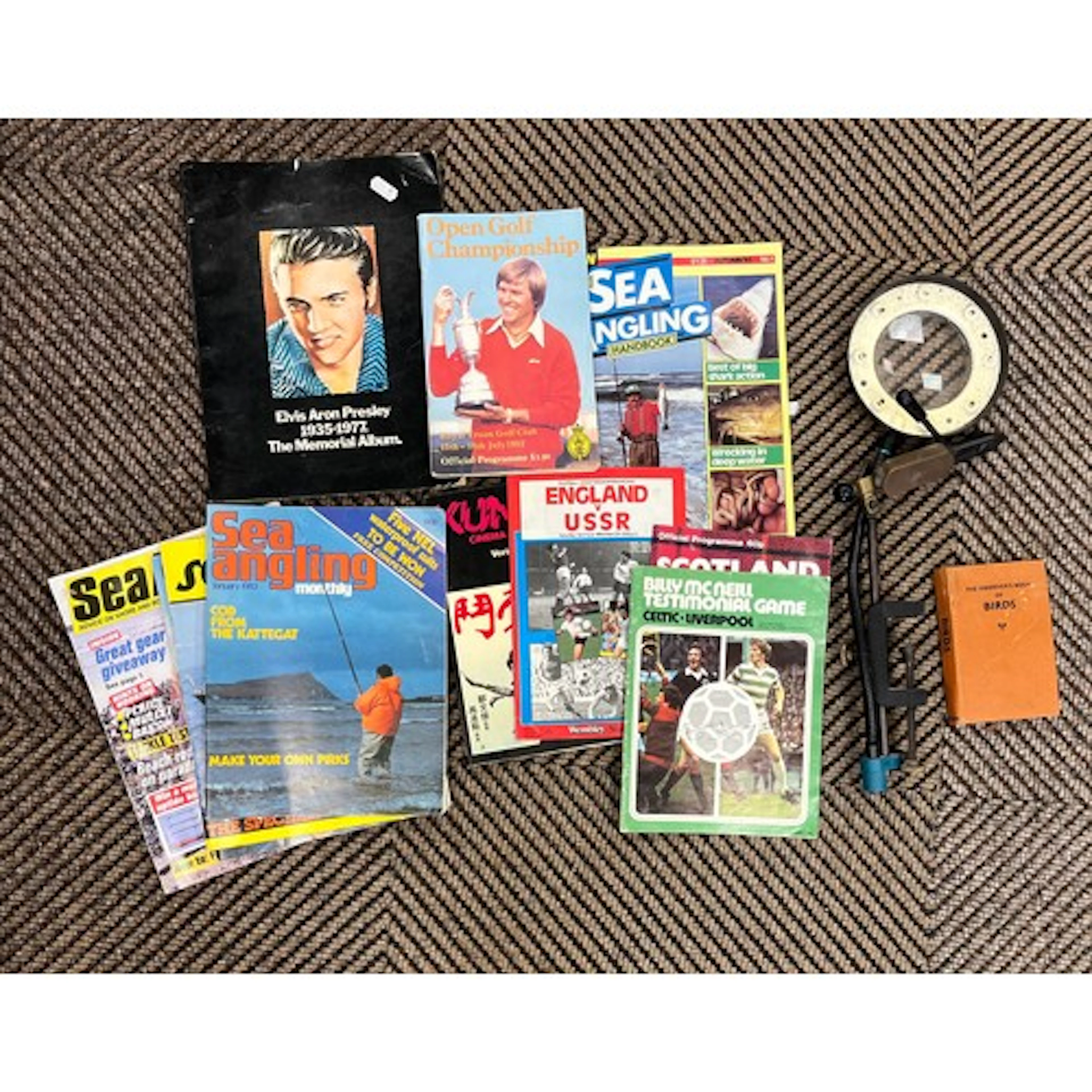 Fishing fly vice and lamp, vintage football programmes, Elvi...