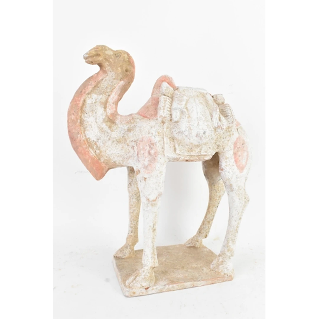 A Chinese pottery figure of a camel, Tang Dynasty (618-907),...