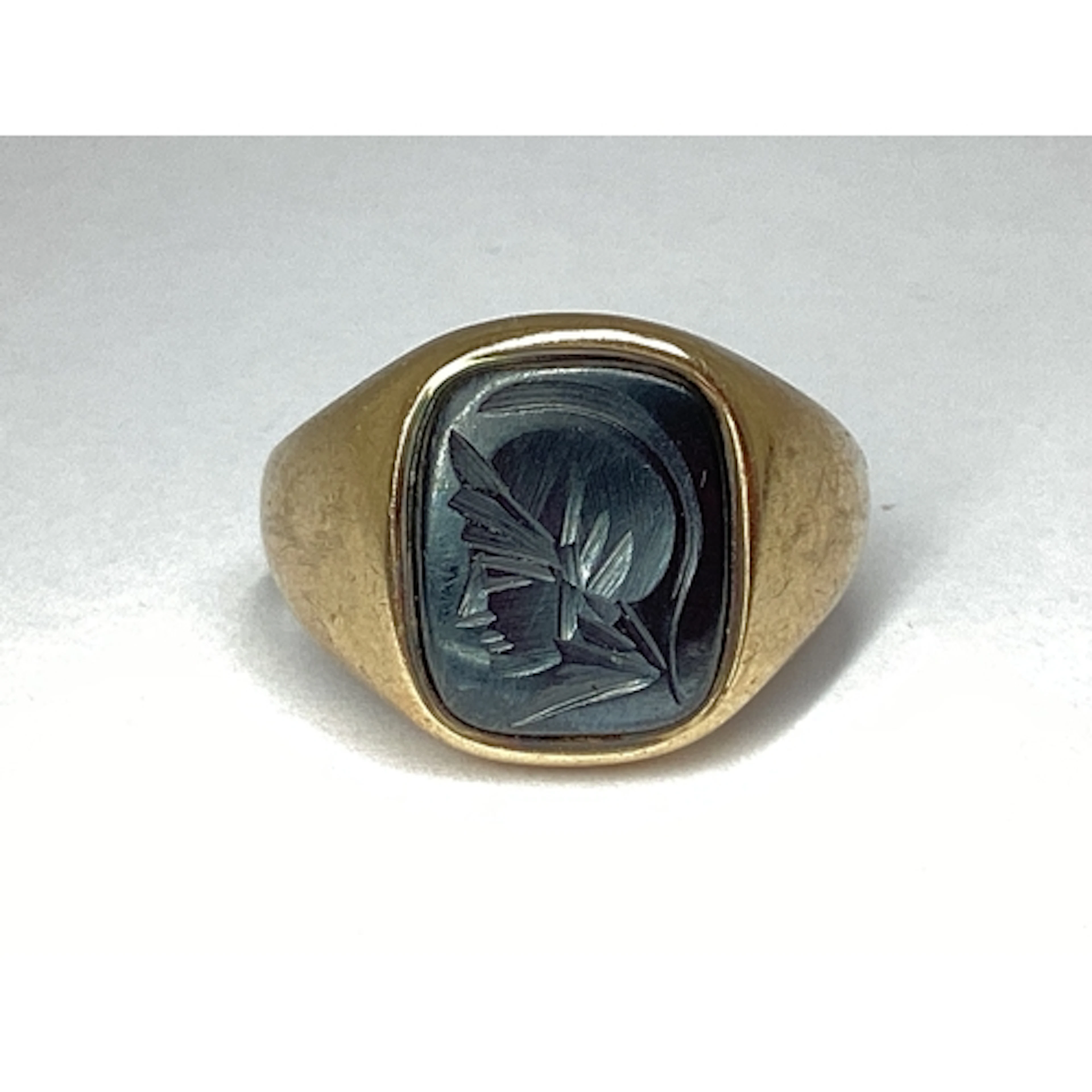 A 9ct Gold Hematite Set Signet Style Ring, the cushion shape...