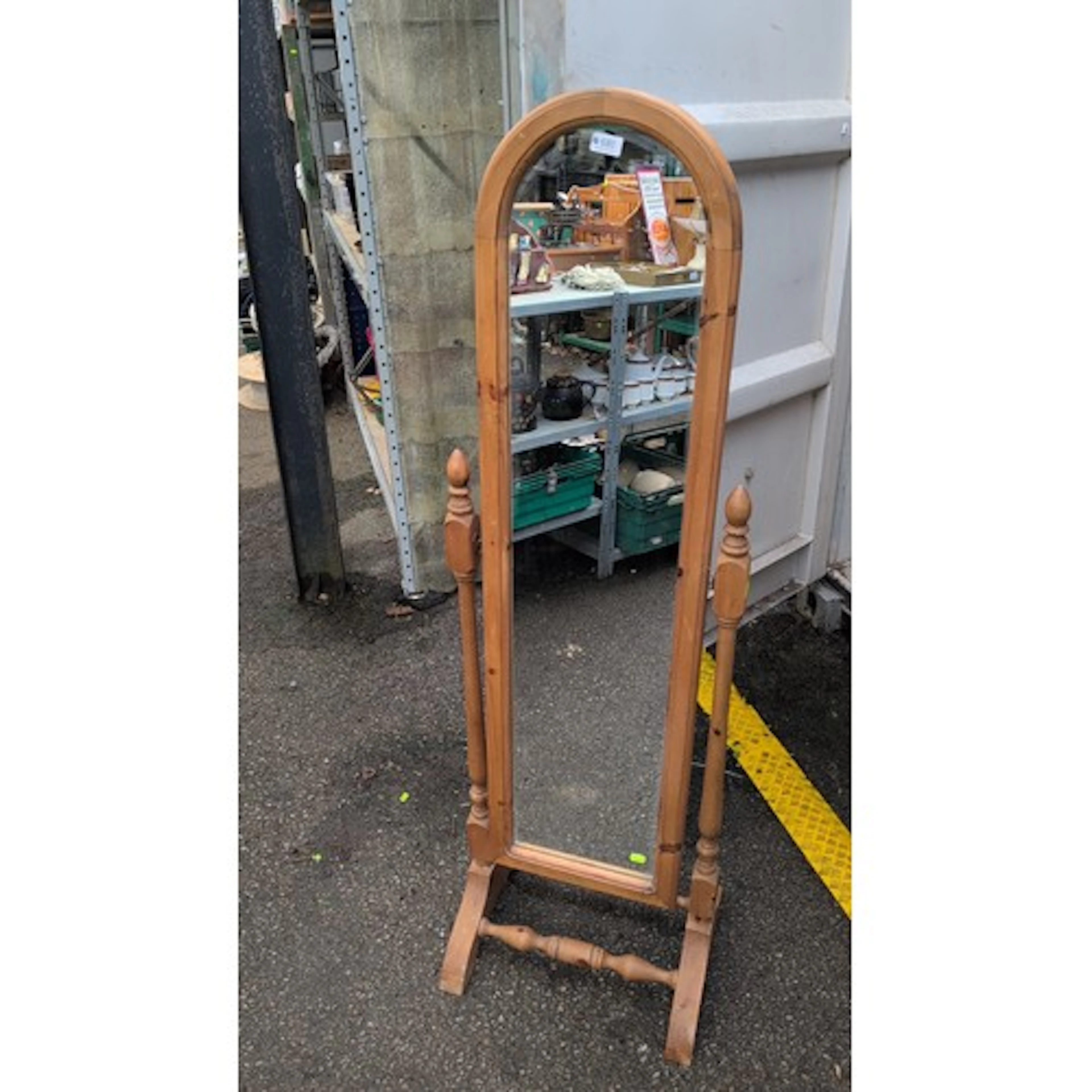 Freestanding pine cheval mirror, the arched plate within a p...