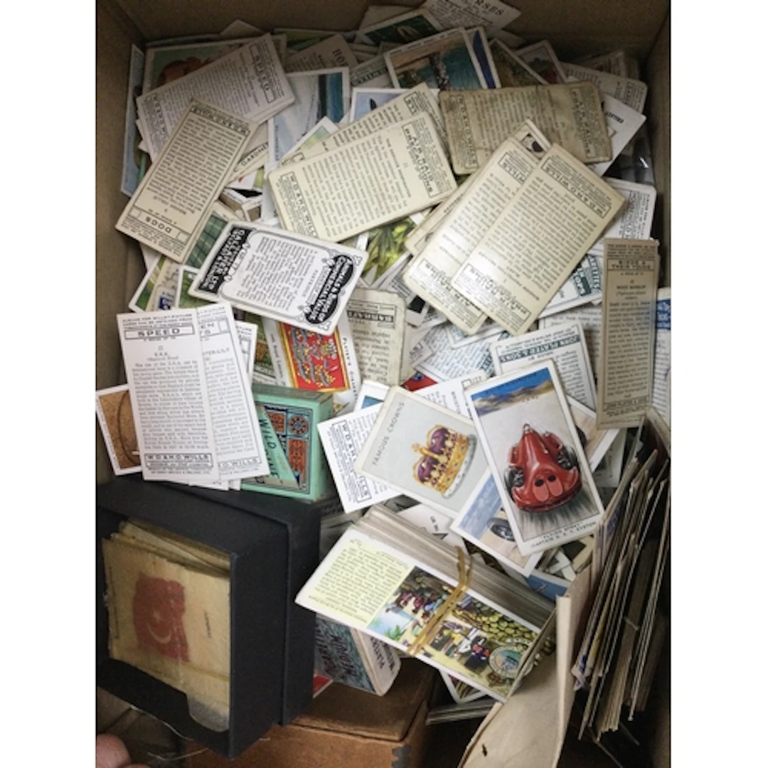 A box of cigarette and trade cards , no reserve