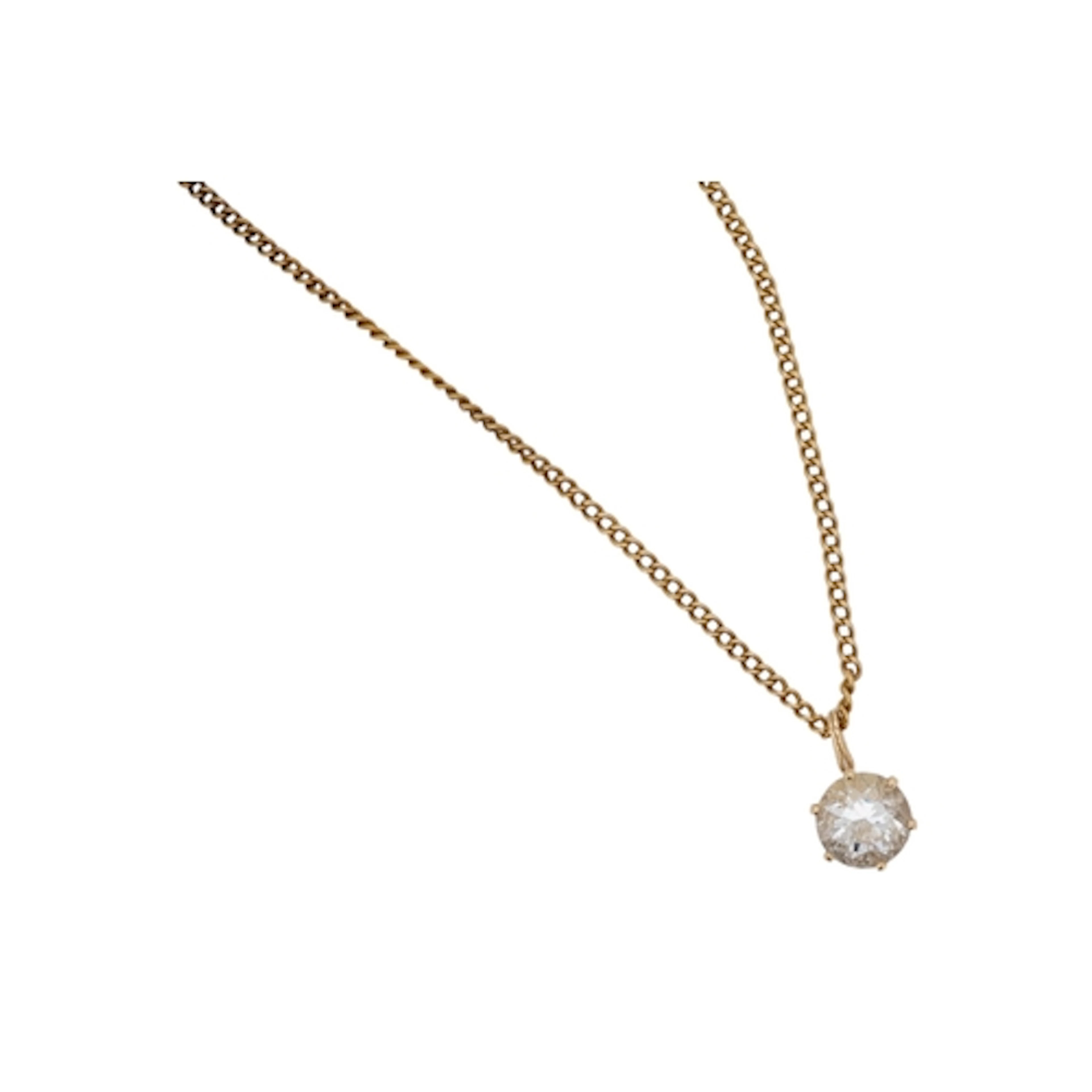 A yellow metal and single stone paste set pendant, on a yell...